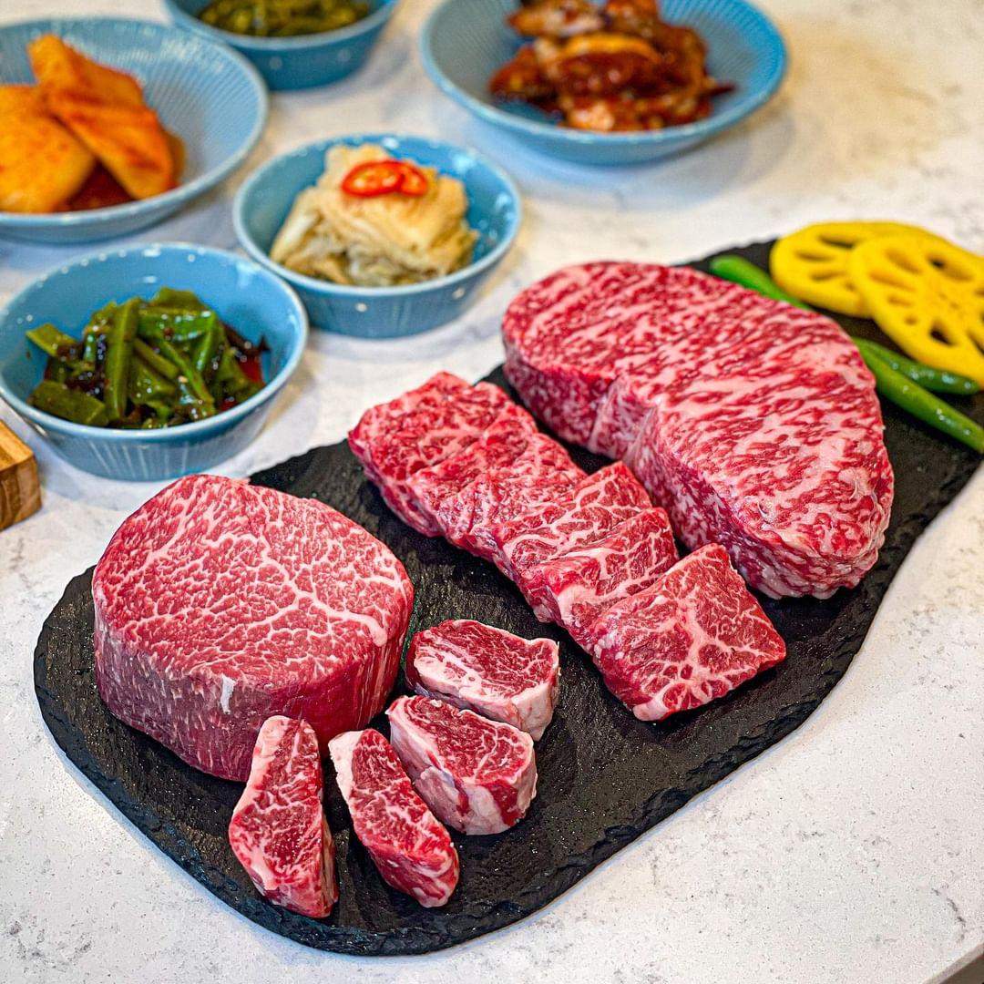 Woo Marble chef grilling aged Hanwoo cuts