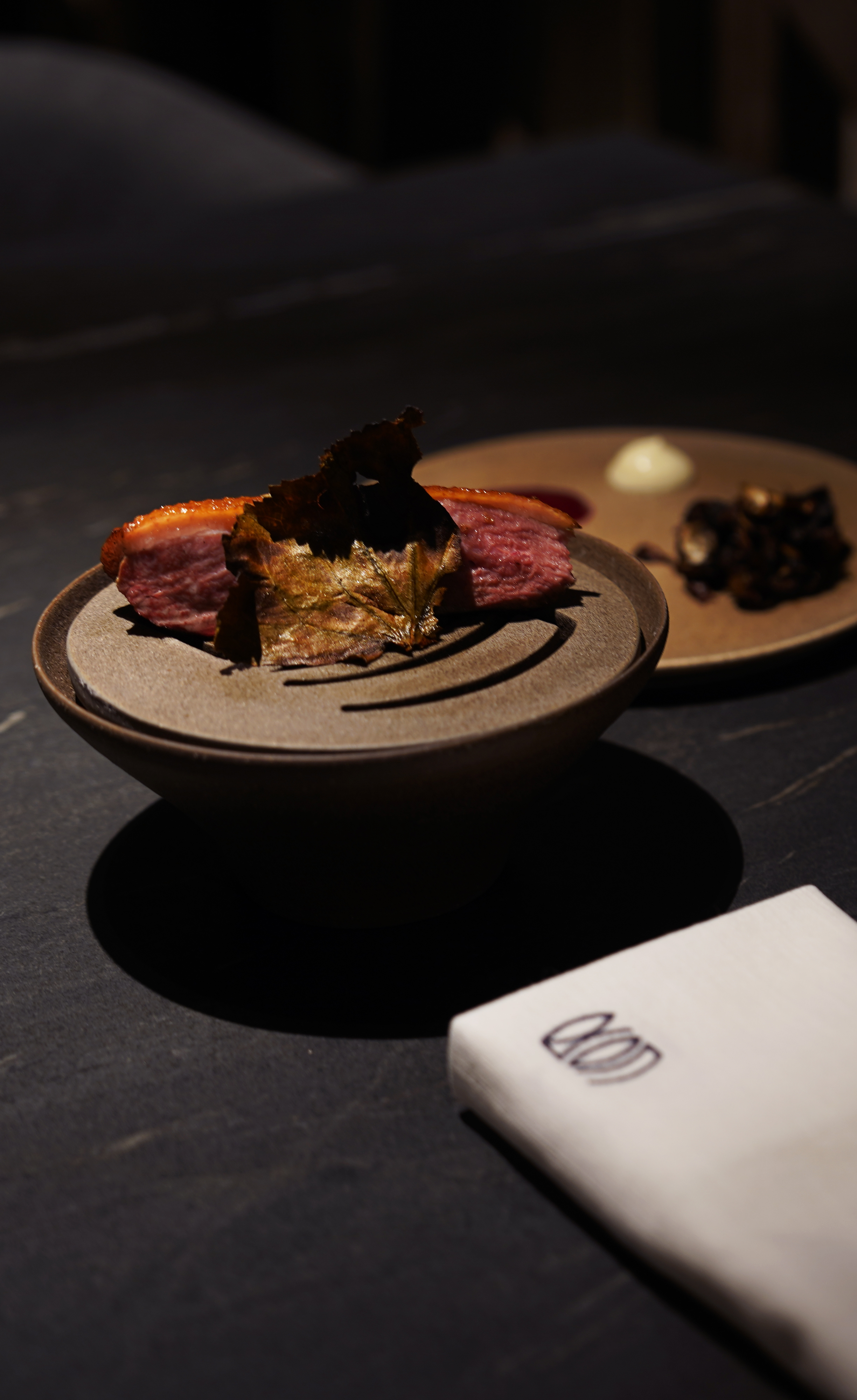 Dining Oeun seasonal course in speakeasy-like setting