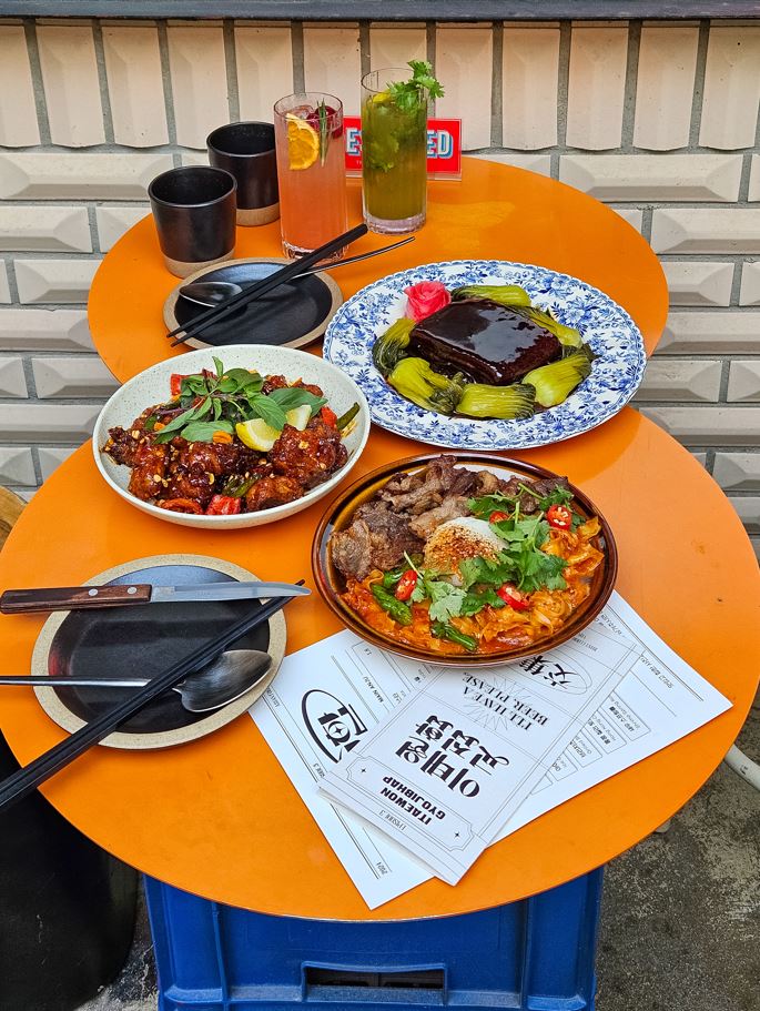 Itaewon gyojibhap neon-lit dining bar with small plates