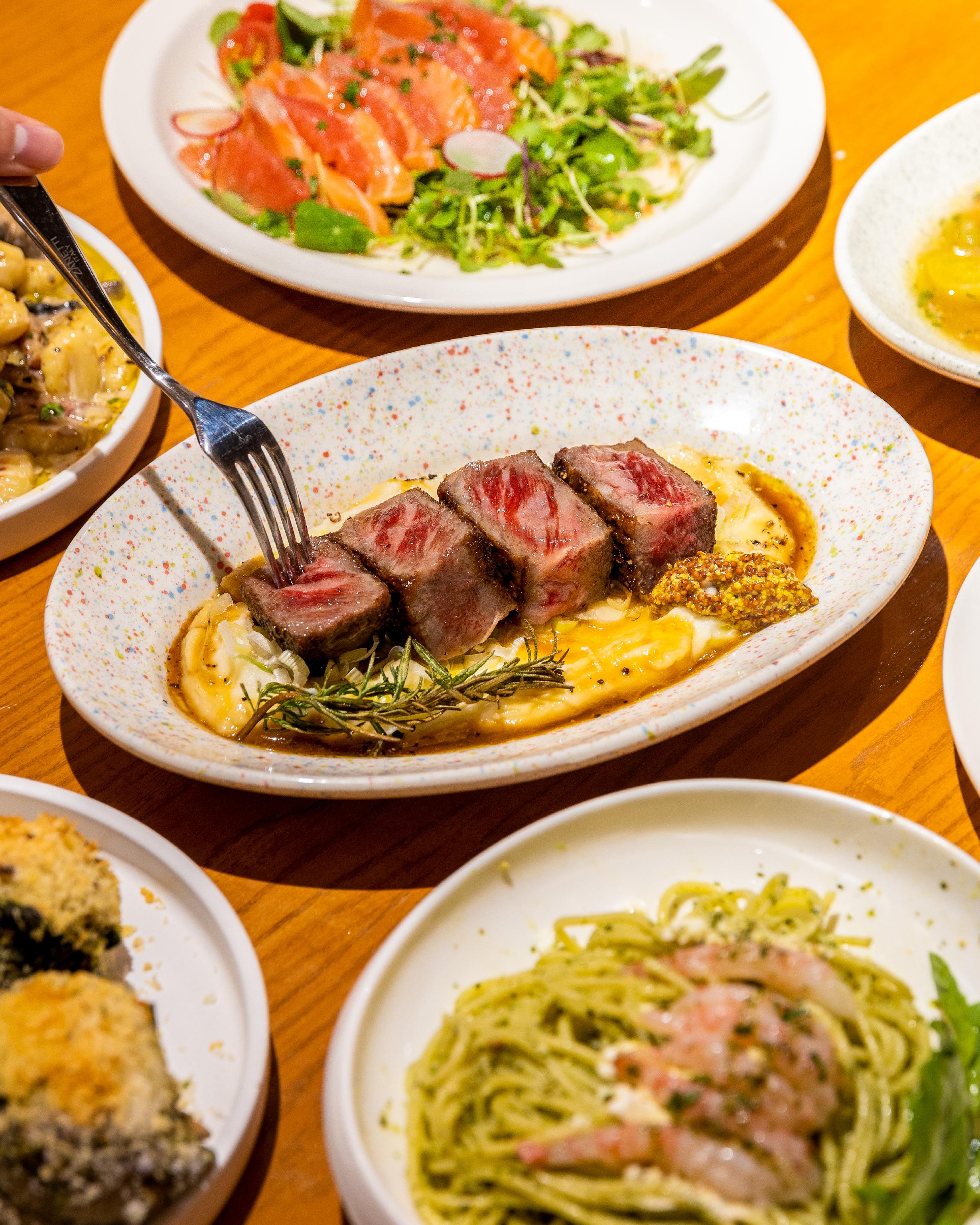 Warm wine bar scene at Boire Seongsu with sharing plates