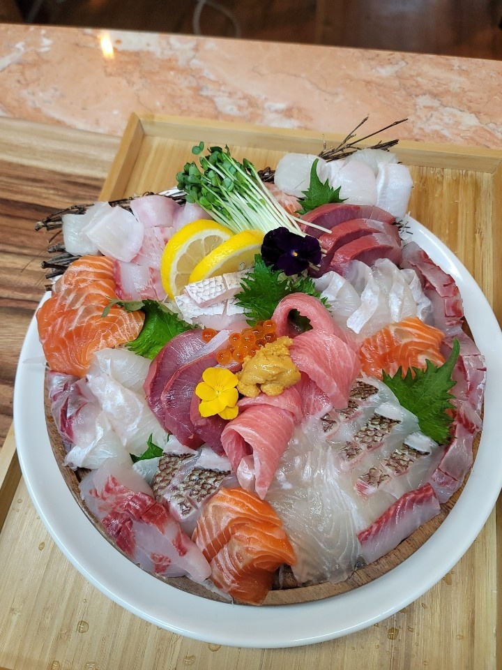 Jo's Three Meals aged sashimi course arranged on ice