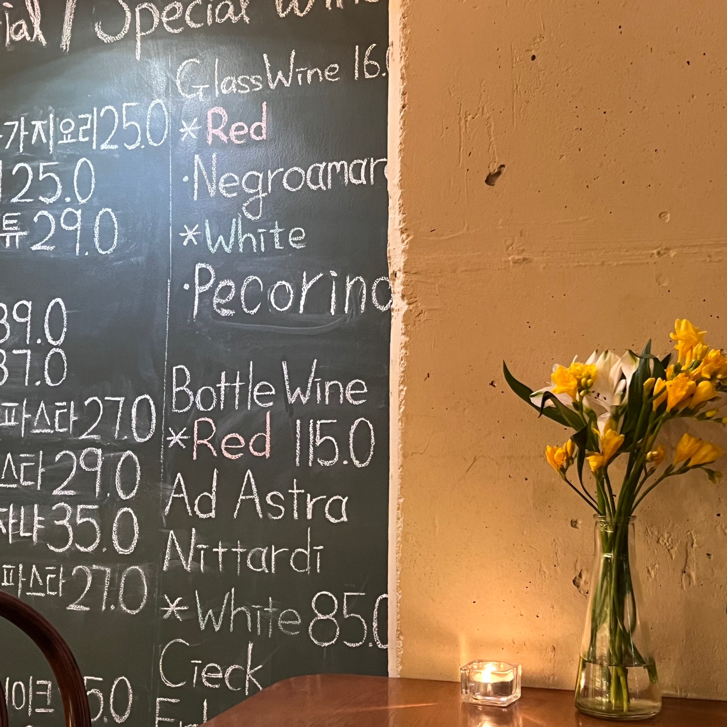 Warm-lit dining room and rustic Italian plates at Osteria Sam Kim - Image 3