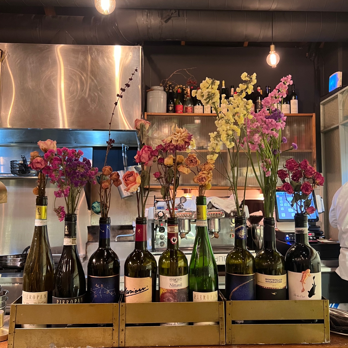 Warm-lit dining room and rustic Italian plates at Osteria Sam Kim - Image 4