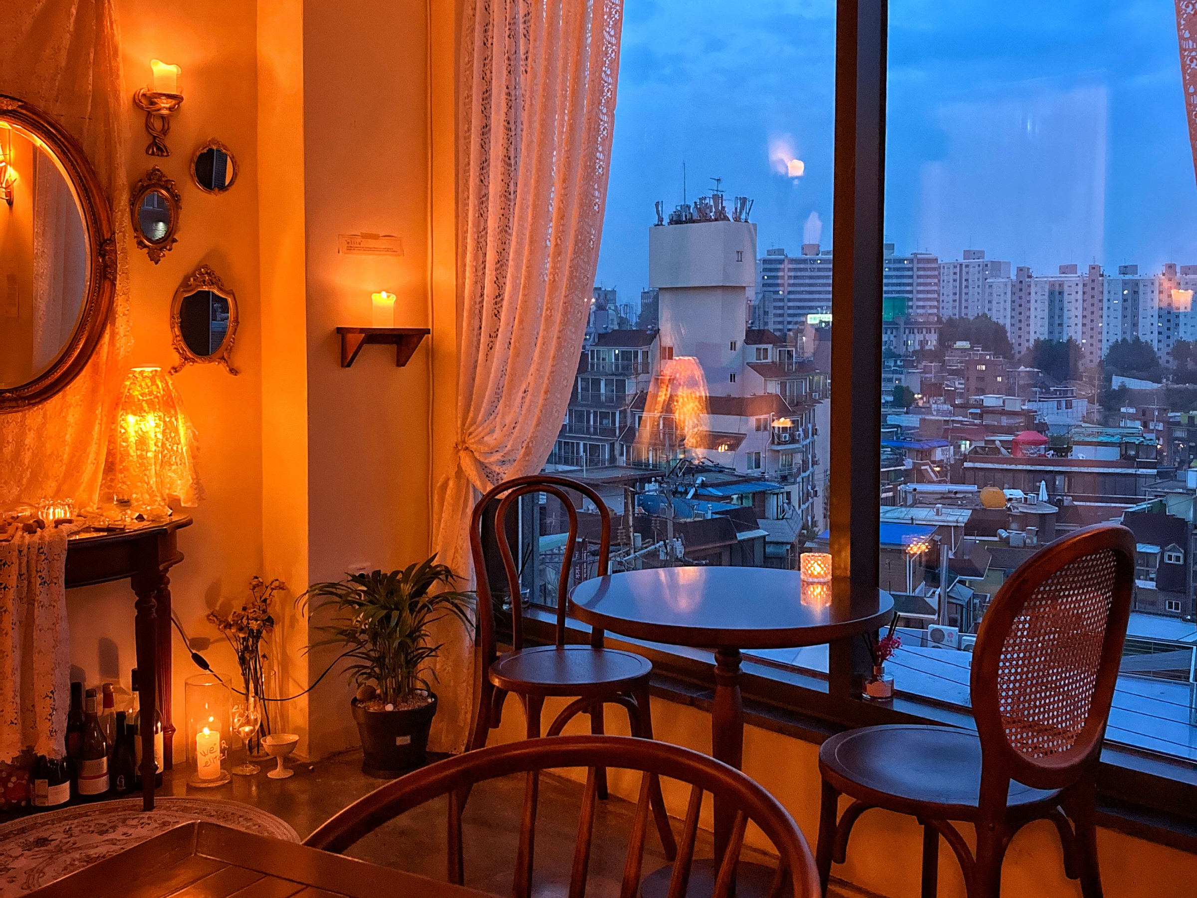 Elite Seoul wine bar overlooking Itaewon skyline at dusk