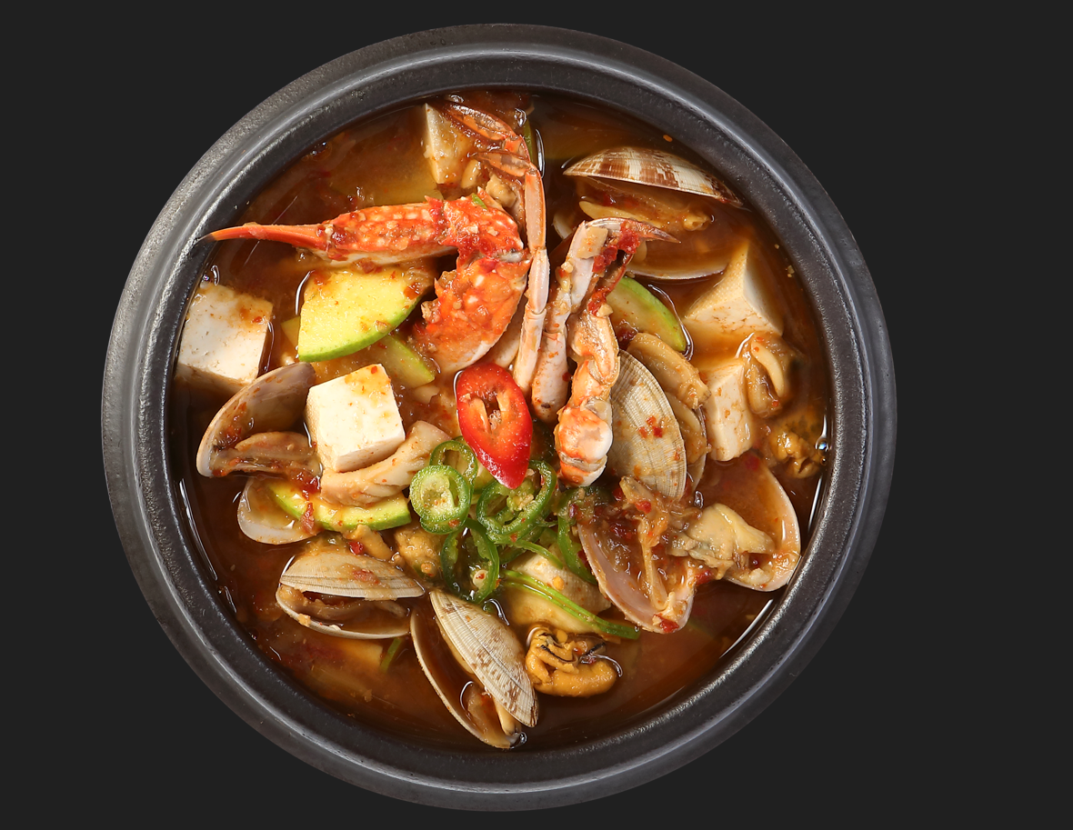 Charcoal flames searing marbled beef at Apgujeong Hwaro Gui