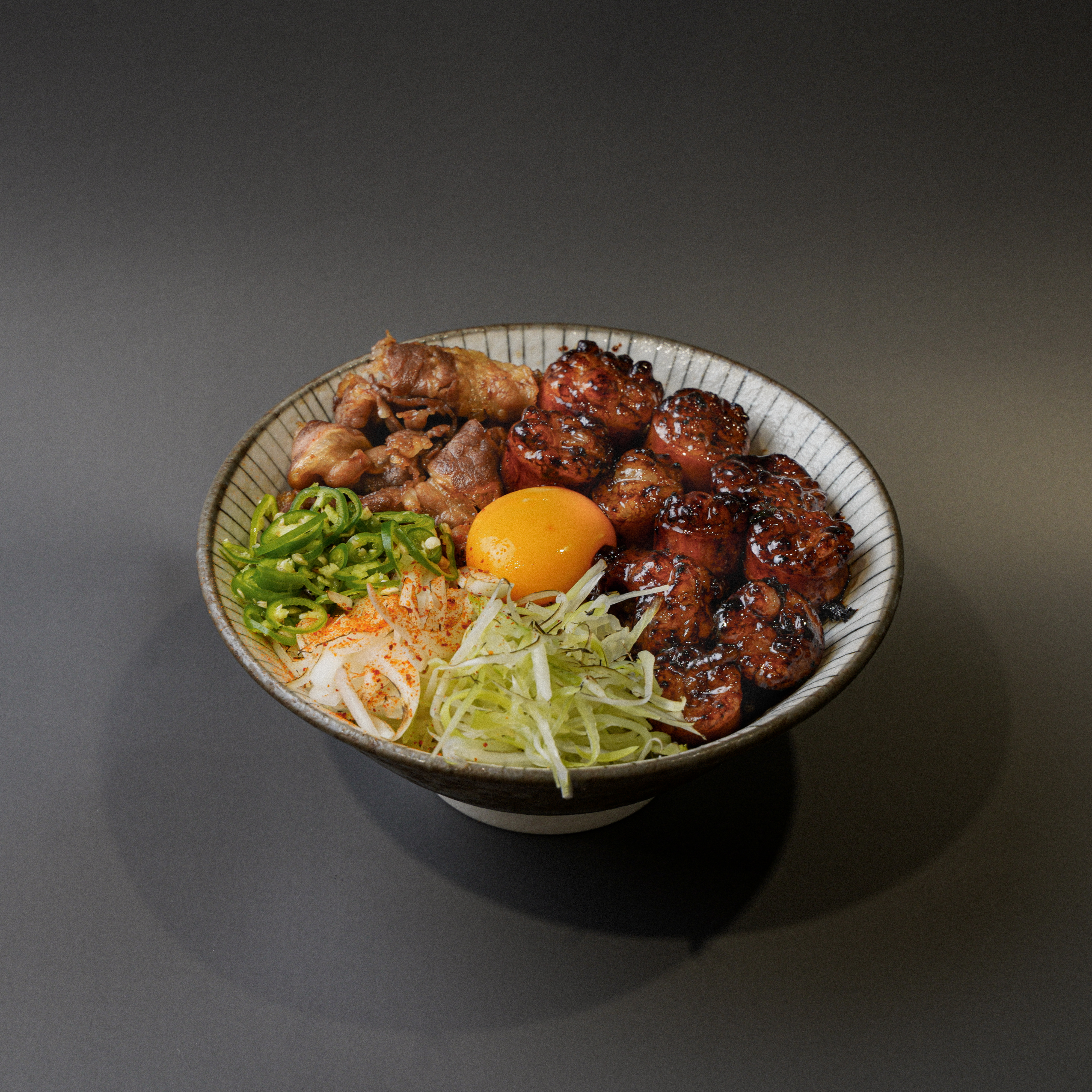 Menchuru Sinchon ramen counter with steaming bowls