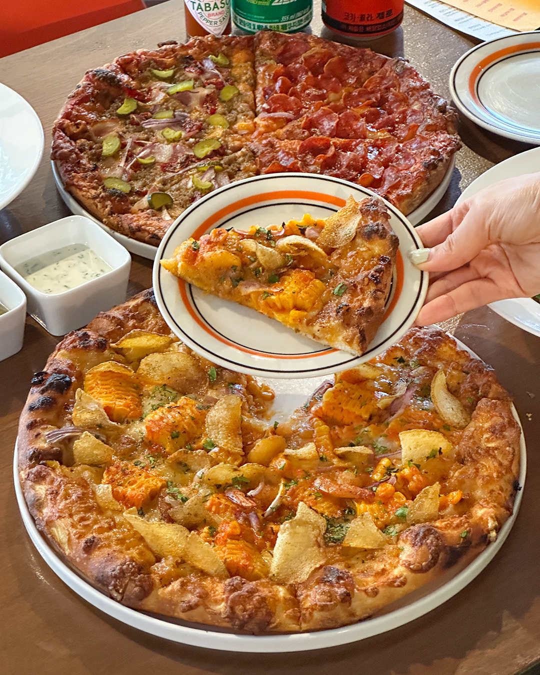 Prove Pizza slicing 48-hour fermented crust fresh from the oven