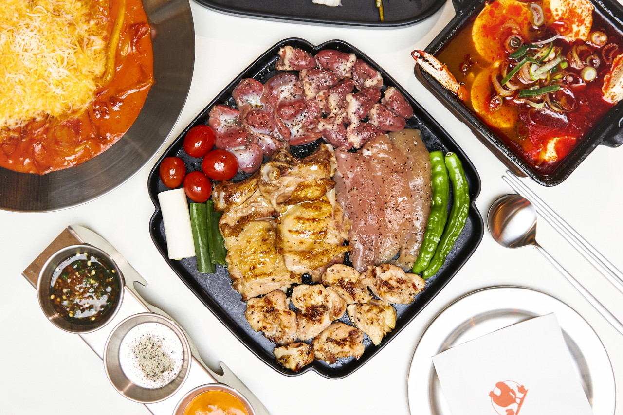 Gyeokjung Mullae charcoal inspired ceramic grill chicken and sides