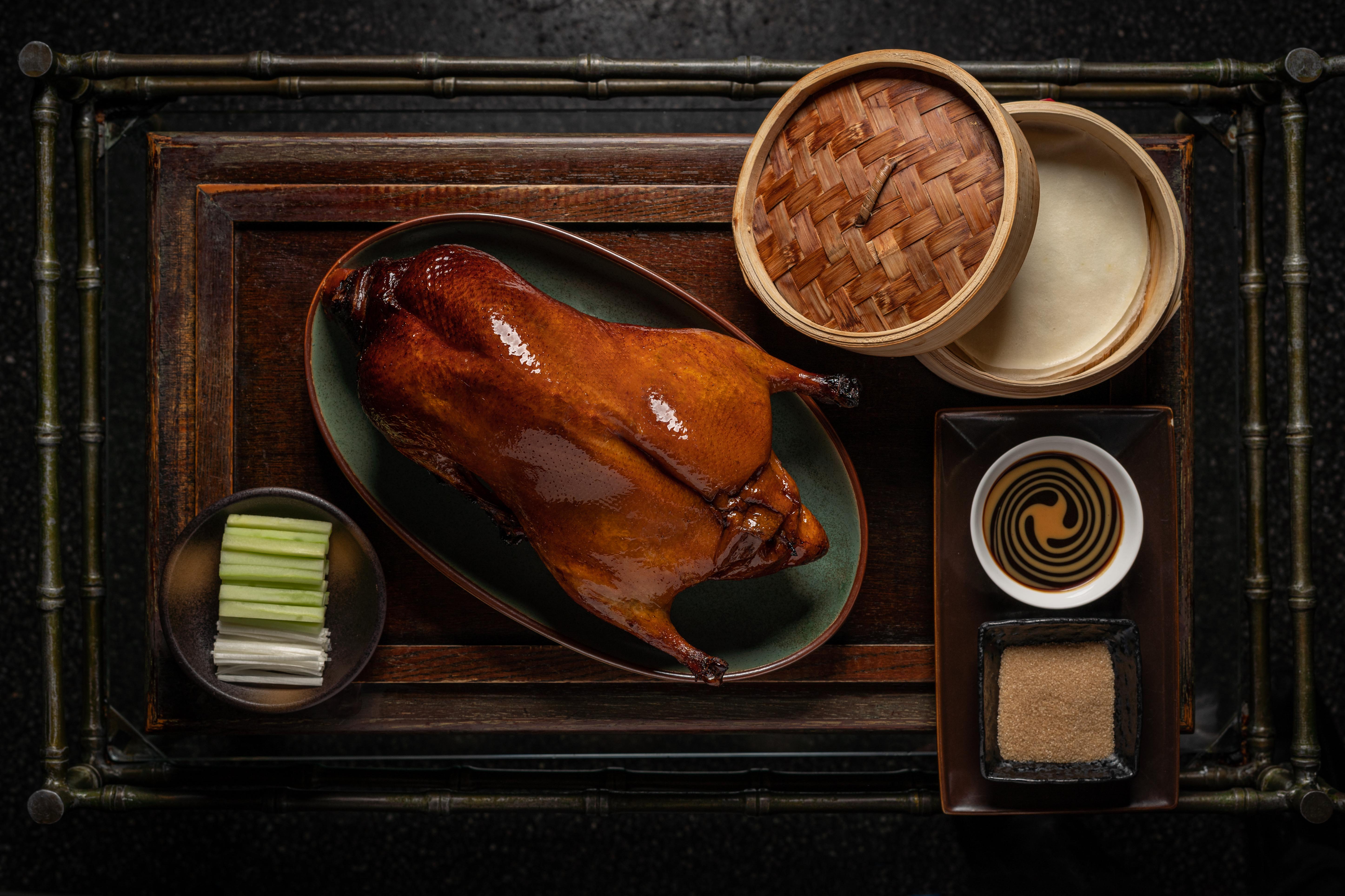 Peking Duck trolley and modern dining room at MOTT 32 Seoul
