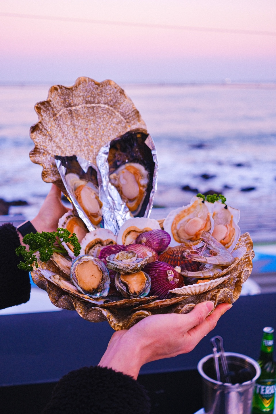Fisherman's Table grilled clams with ocean view at Songjeong