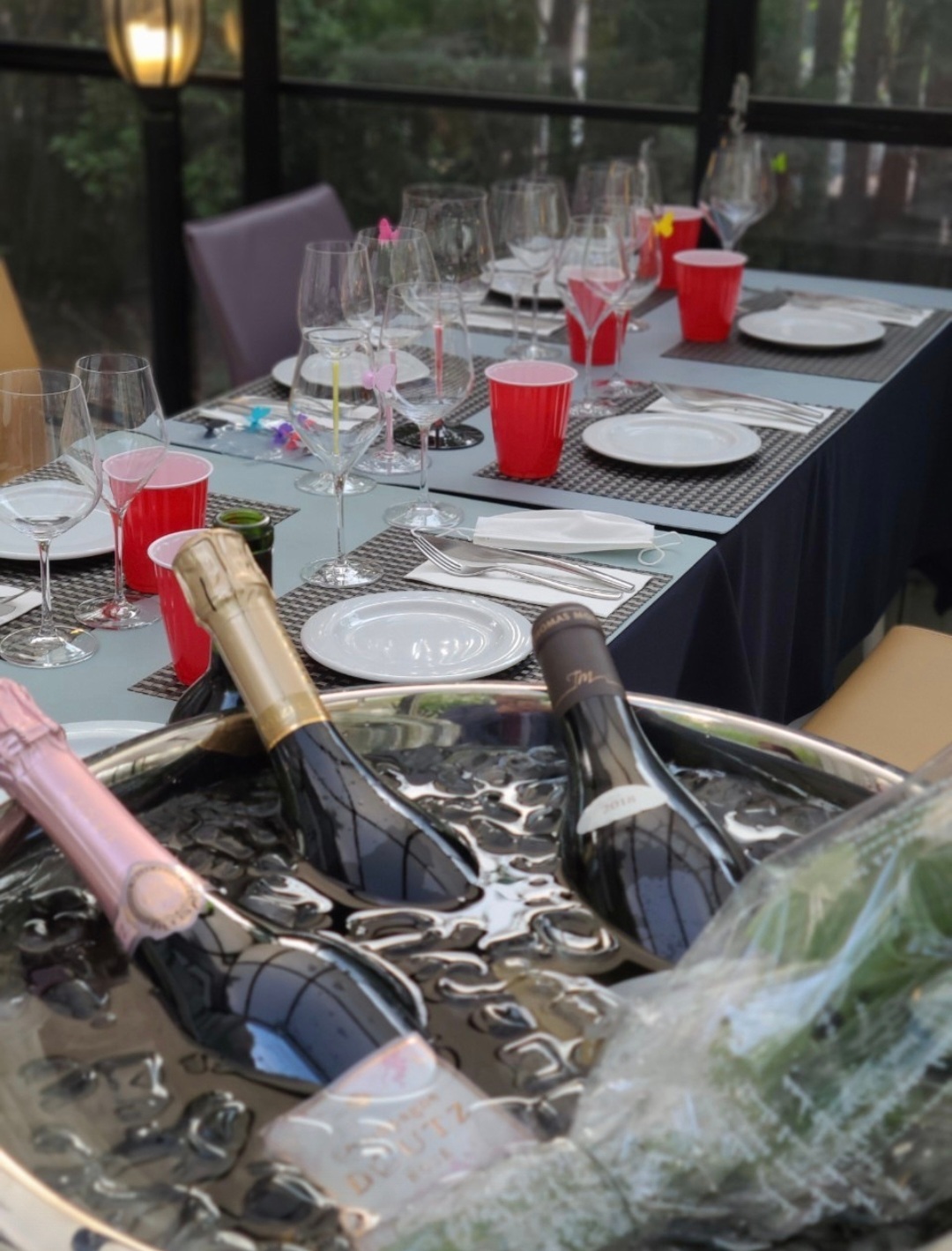 J's Garden terrace and wine-lit evening scene