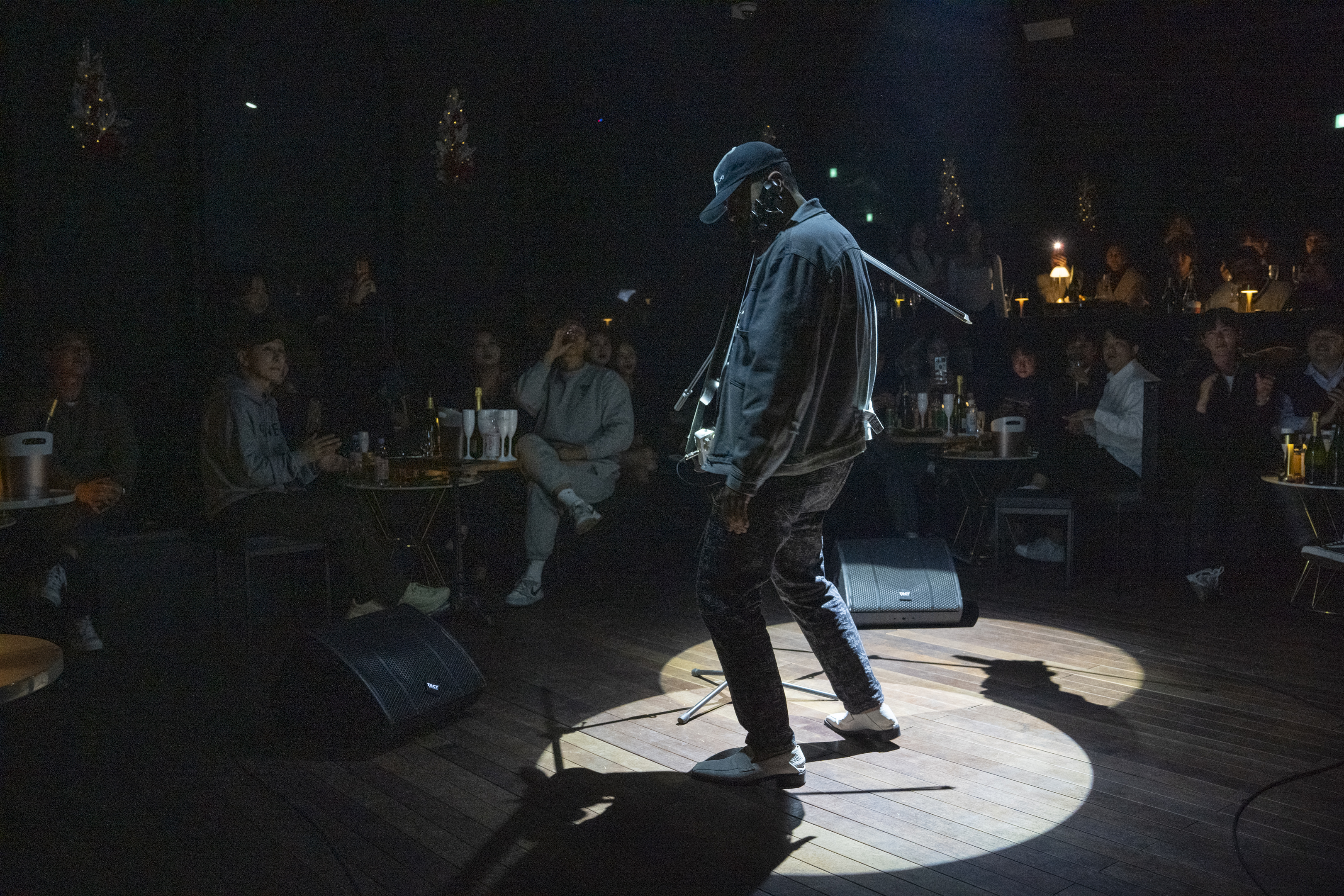 LUX Lounge live music stage with audience and drinks