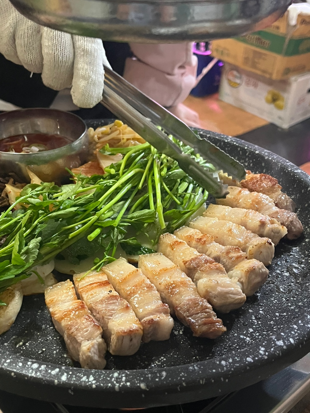 Dulumi Gwangan Jeju pork belly grilling with seaside glow