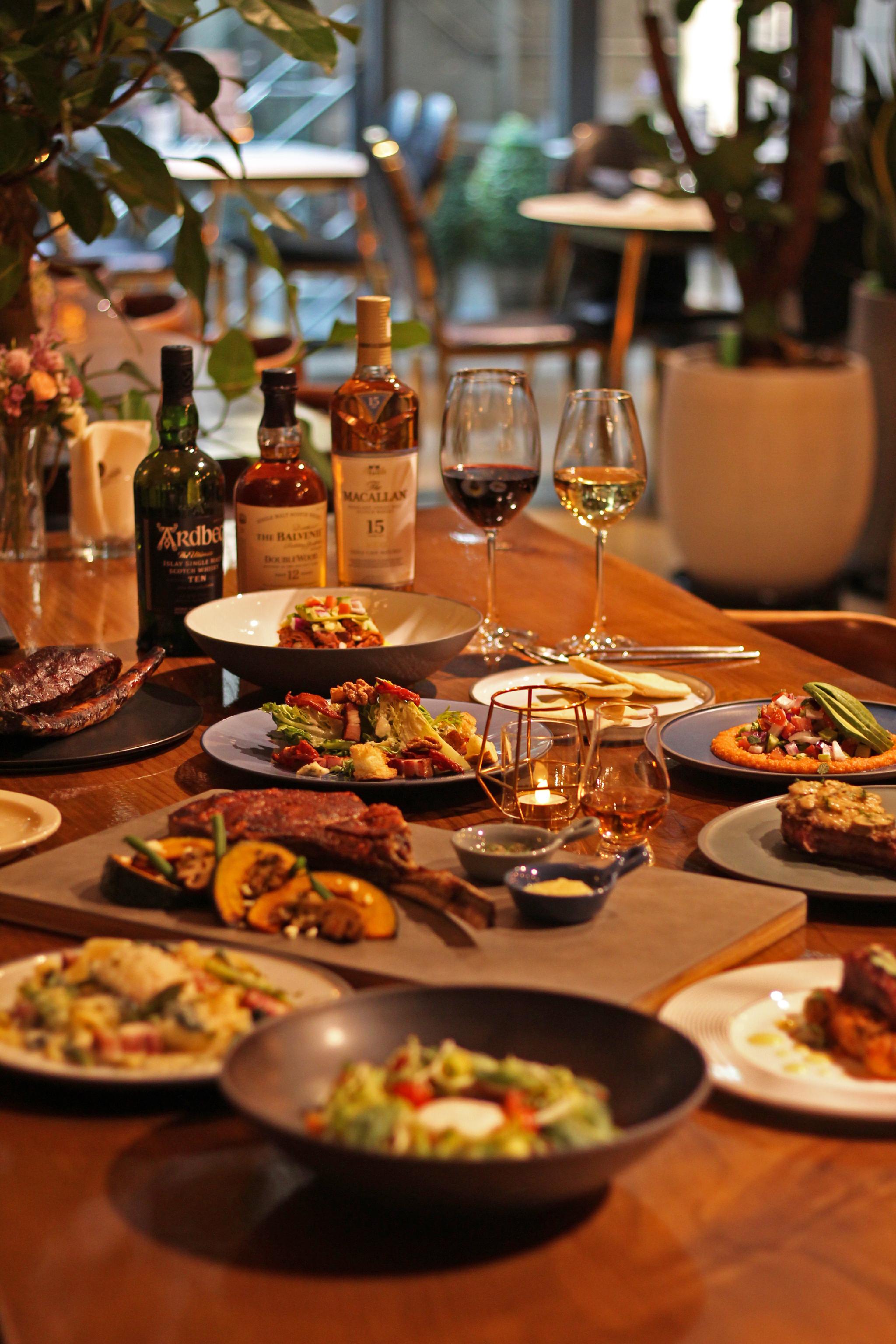 Smoke Bunker oak-smoked tomahawk and T-bone with cocktails