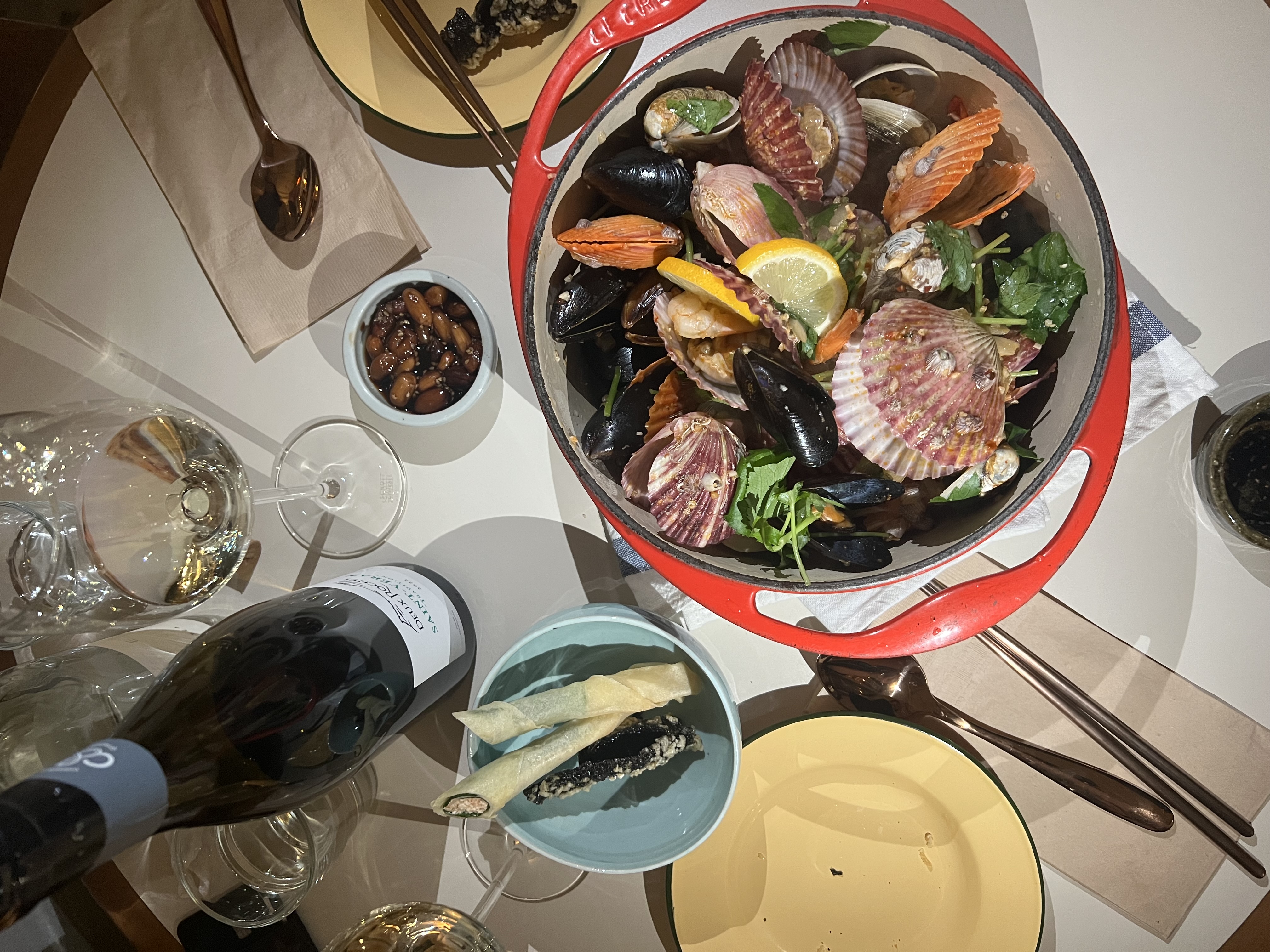 Seasonal Table Korean dishes with wine by a window in HBC