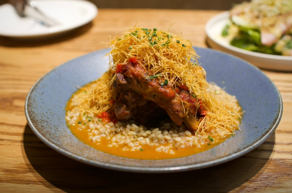 MOO.VEMENT fresh mozzarella plated with tomatoes on marble table