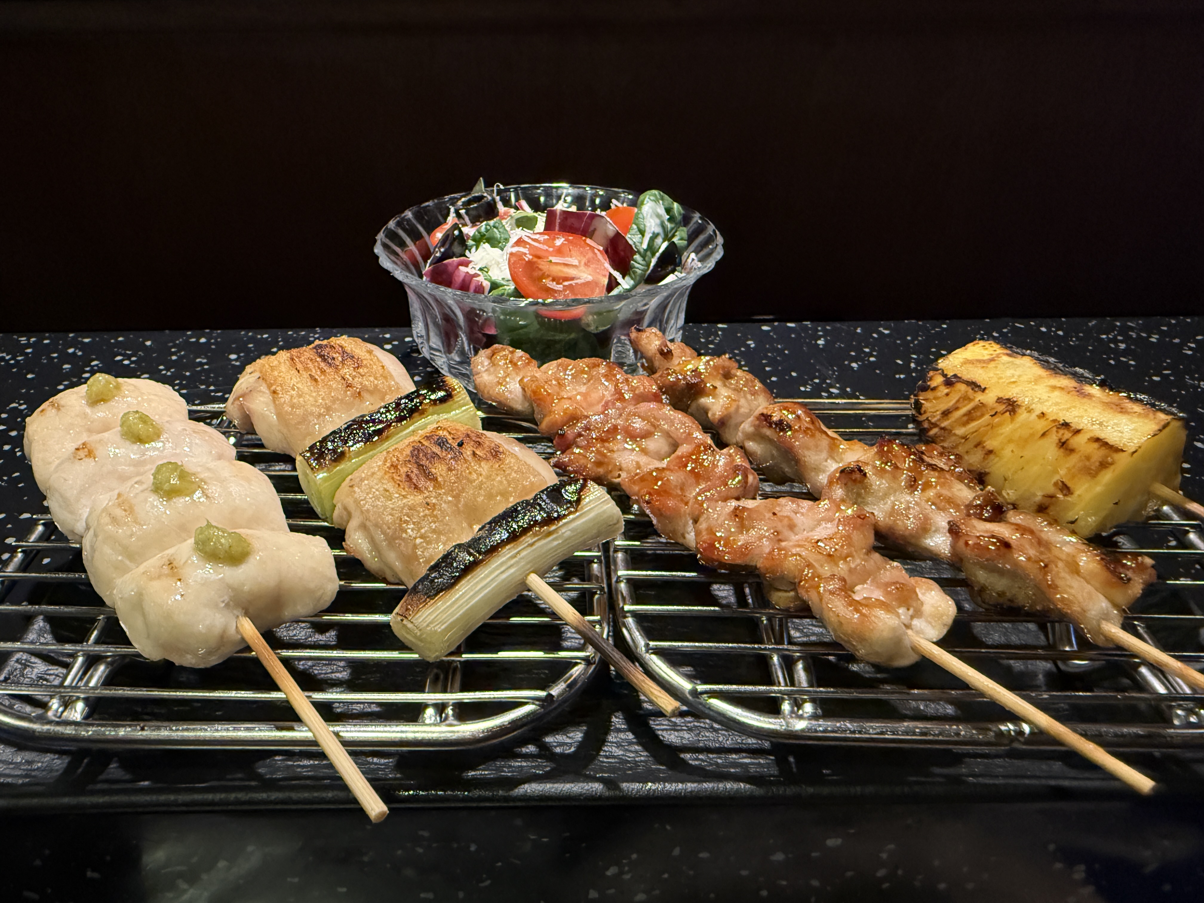 ZJIC yakitori skewers charring over premium charcoal with cozy counter