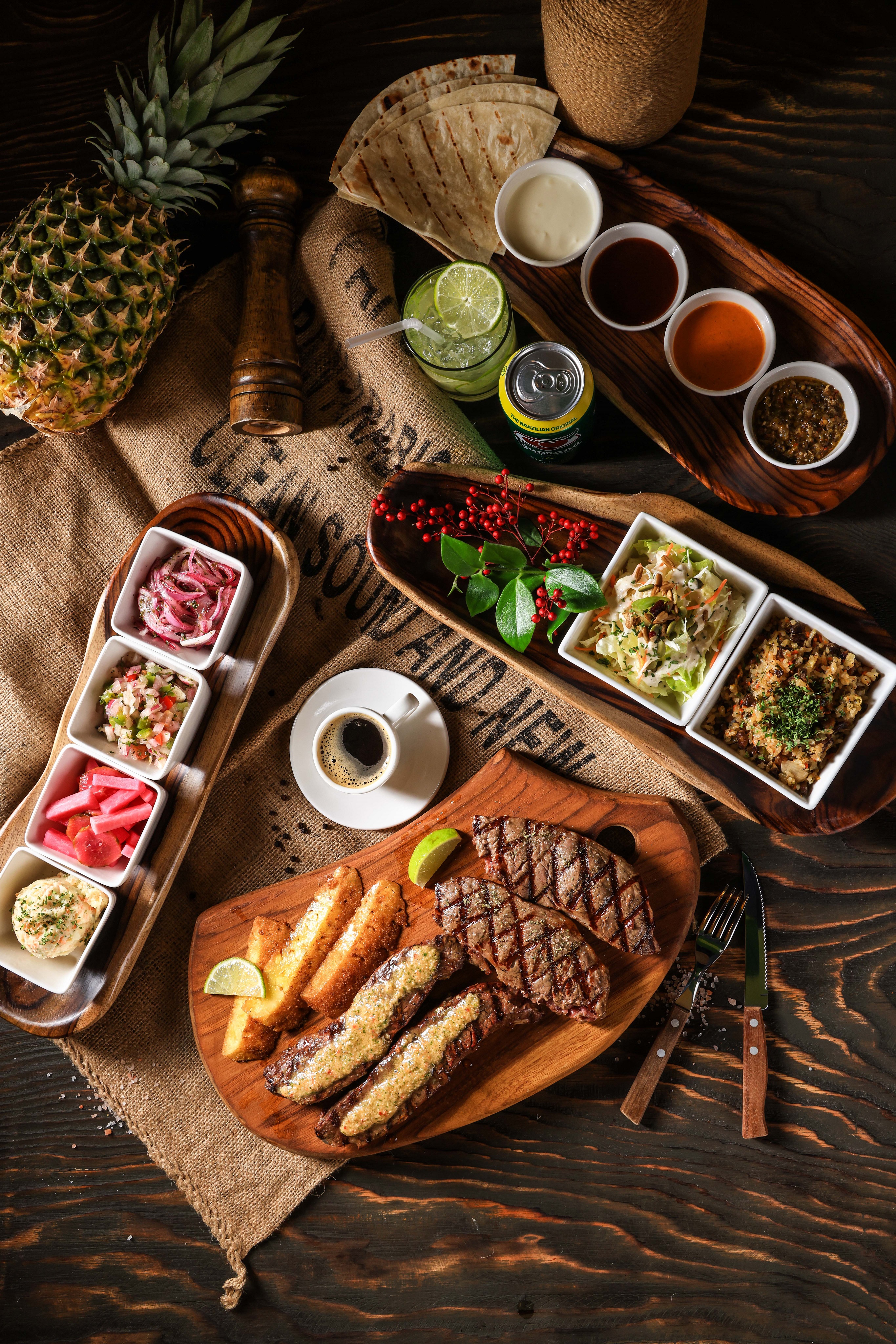Born In Brazil servers slicing churrasco at table
