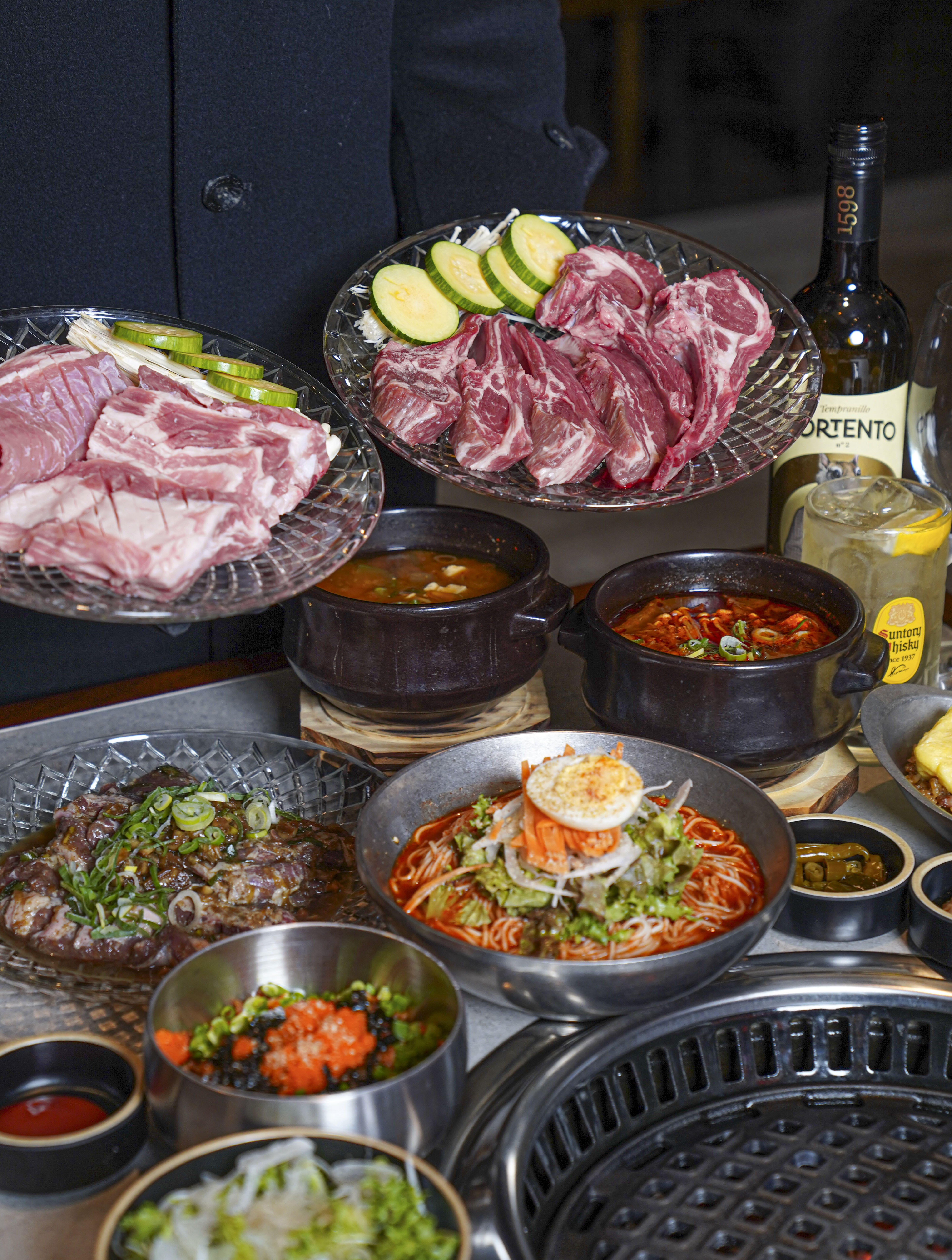 Dongado ocean-view table with grilled pork and refined banchan