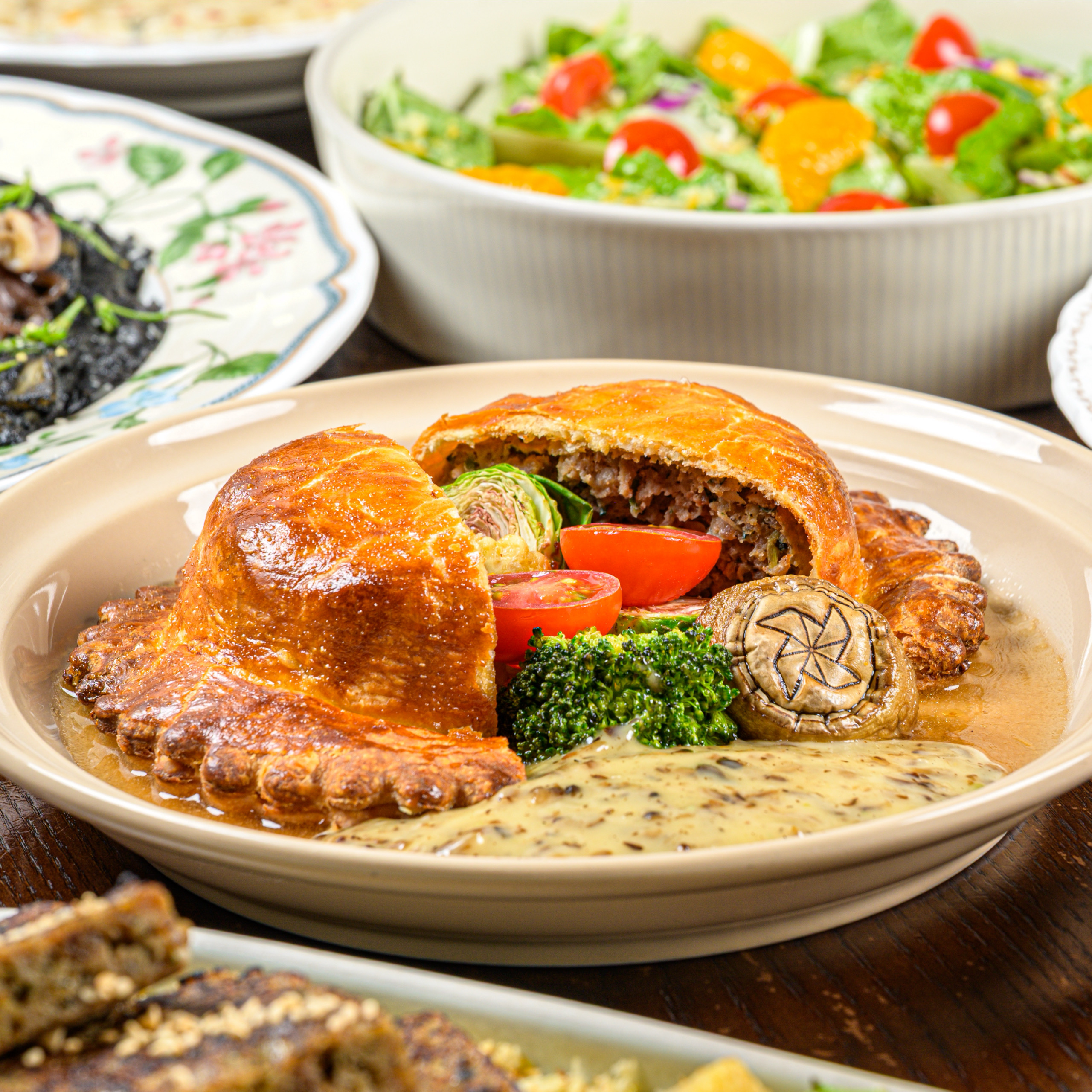Mongsanggaok UFO Wellington plated with roasted vegetables