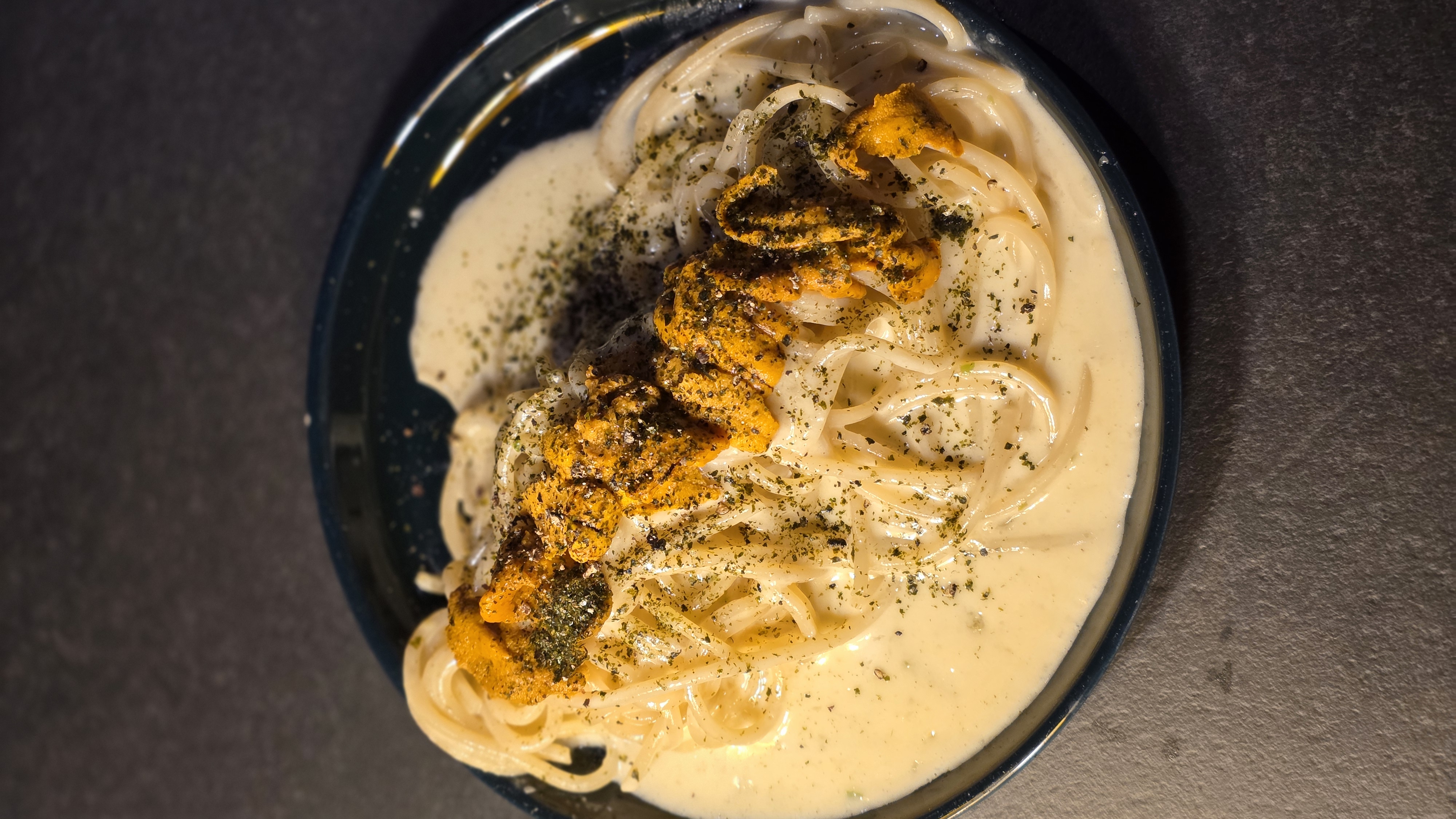 Chez Maum natural wine bar table with basil chicken and glasses