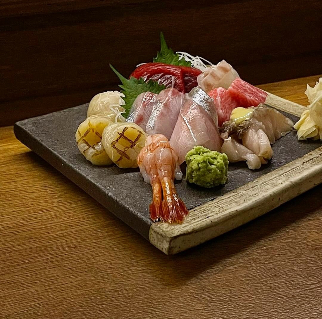 Sangguk Sindang intimate Japanese bar with sashimi plate