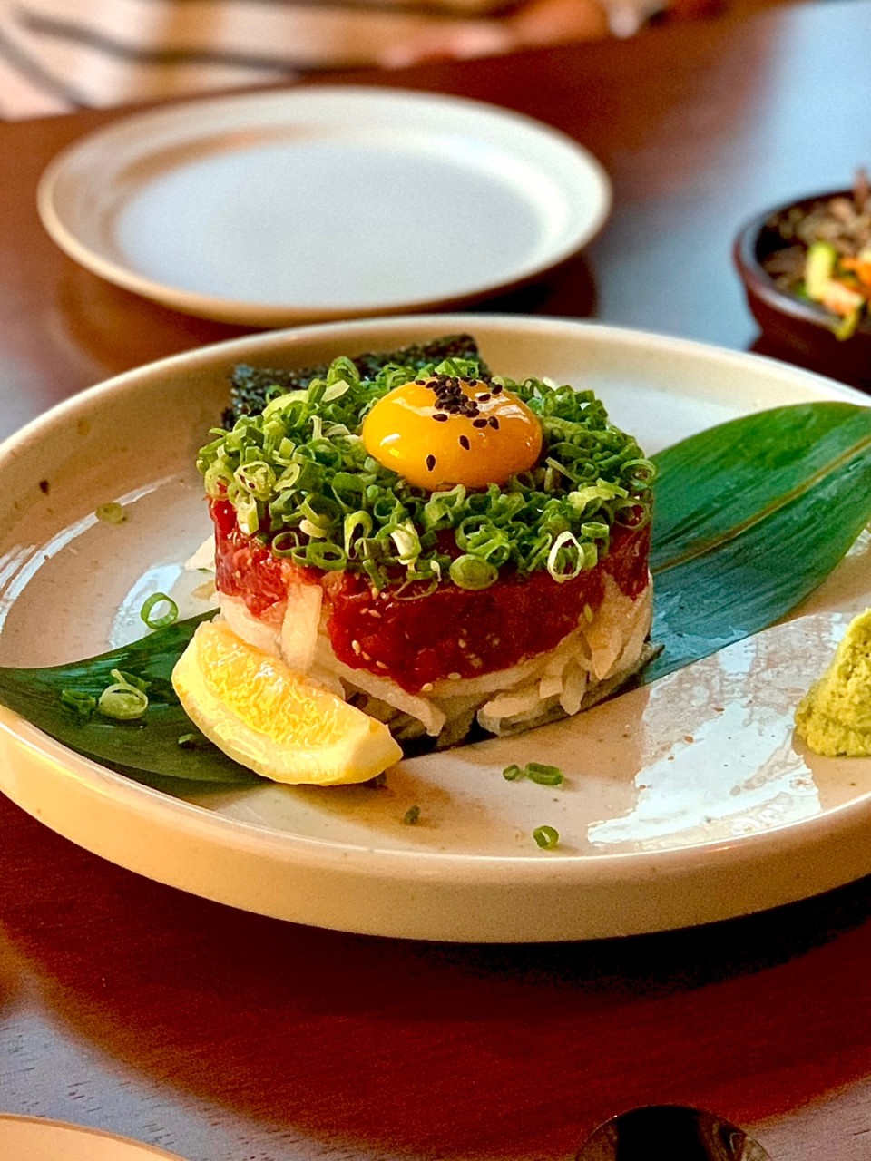 Sangsu House Octopus Bossam plated with greens