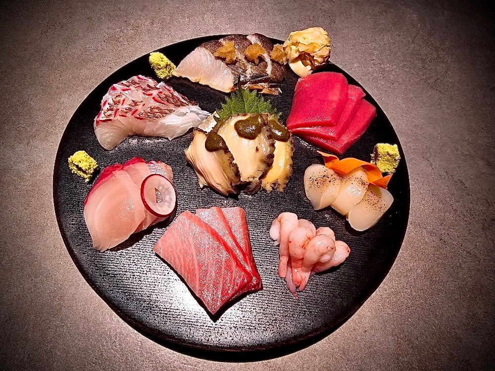 Kasai izakaya plates and premium sake in a chic setting