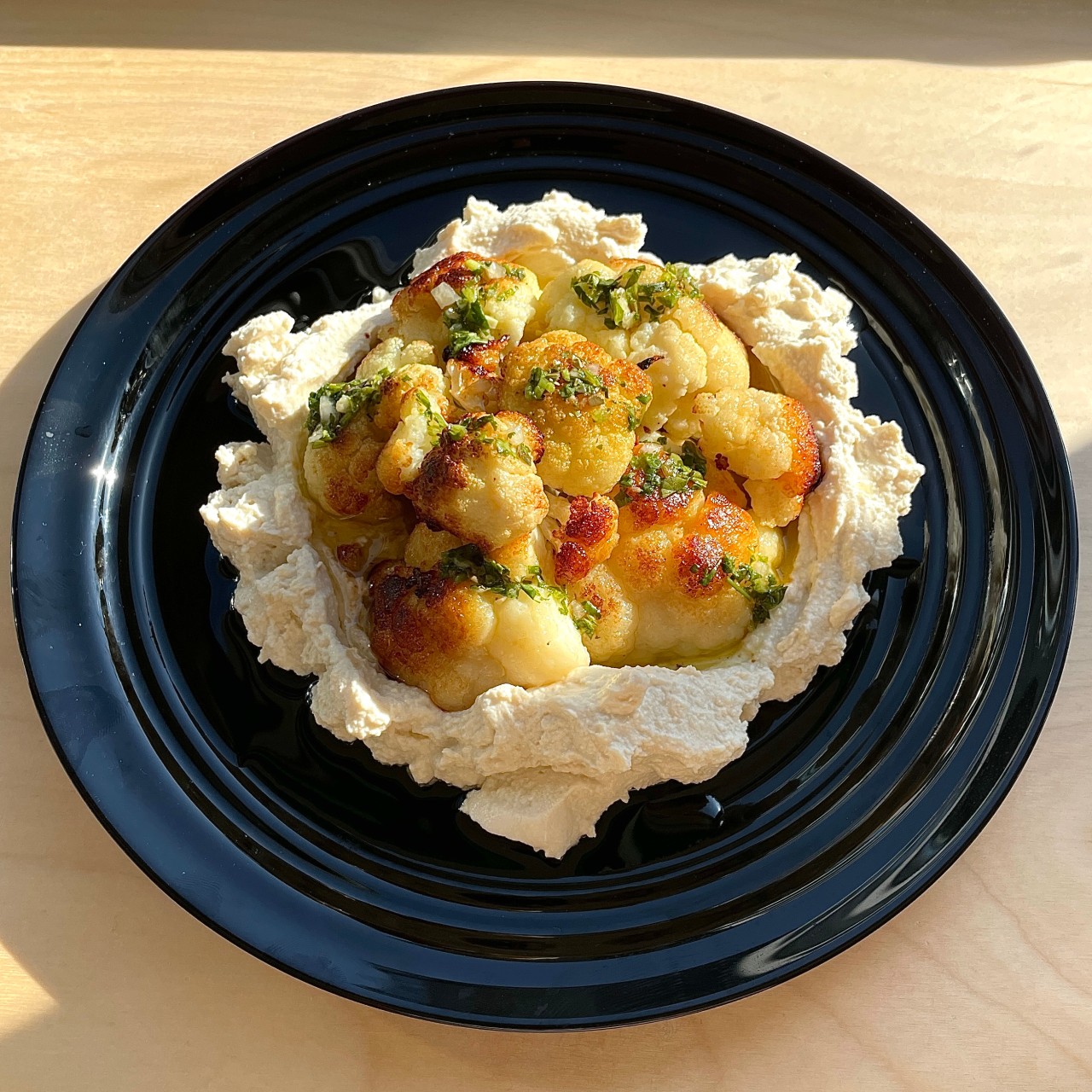 Musch kitchen bar with moody lighting and shared plates