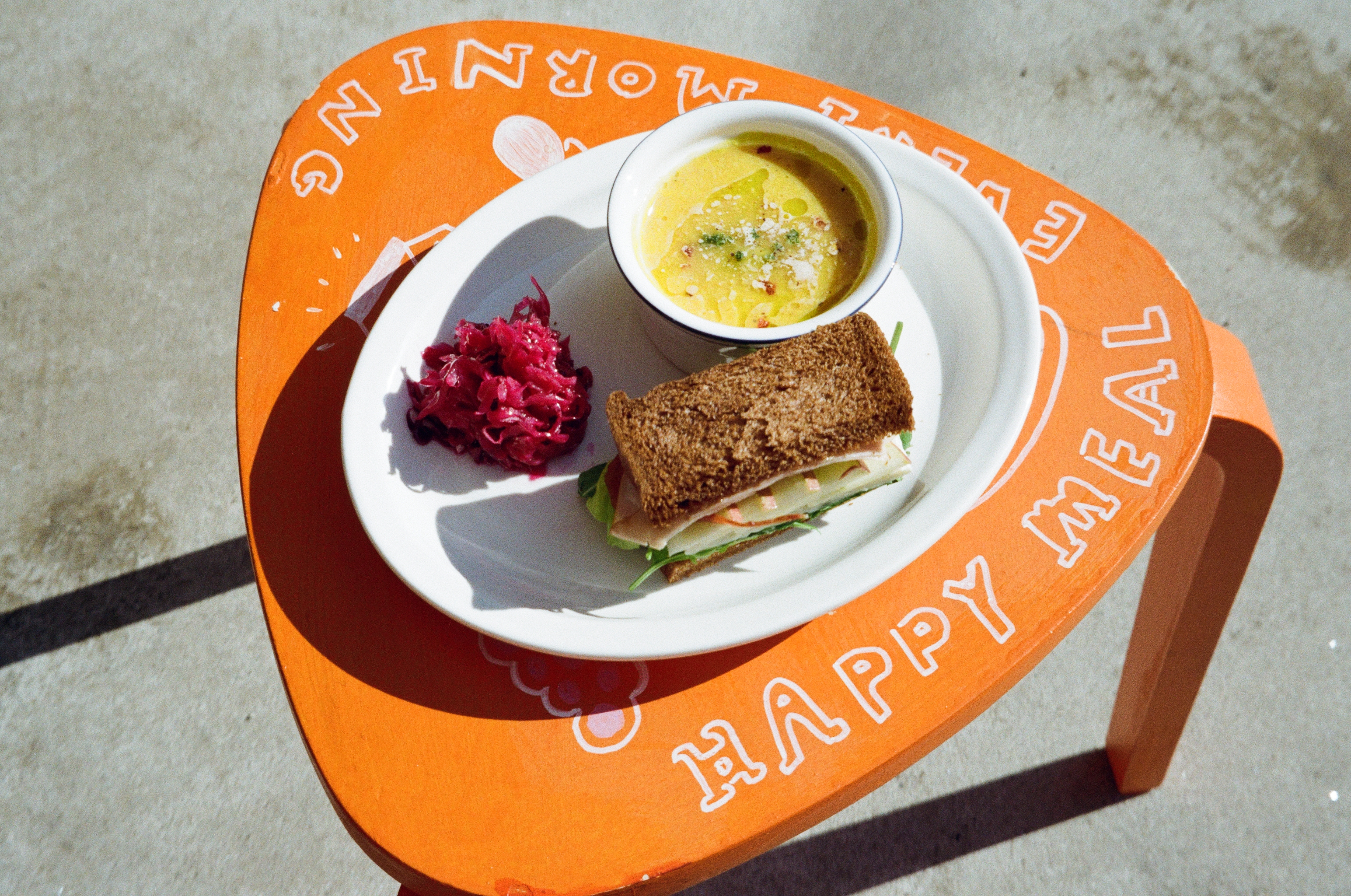 Achim Provision sunlit brunch table with coffee and salad