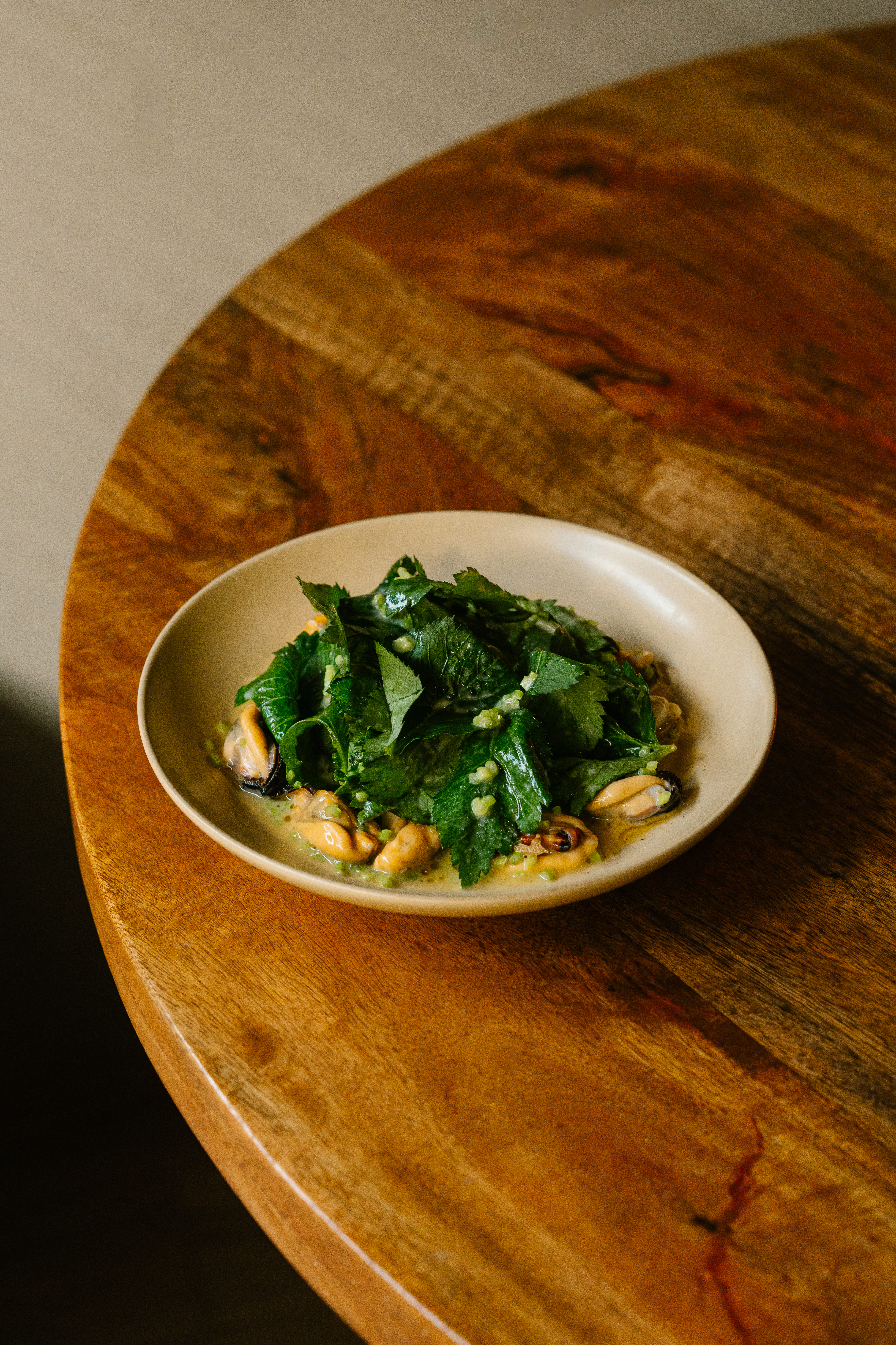 Bonvivant wine bar plates and glasses under warm light