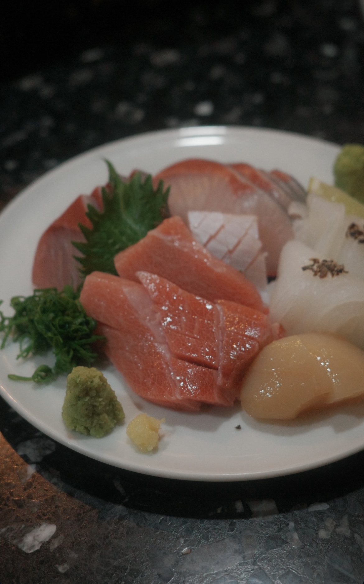 Migaki izakaya counter with seasonal dishes and sake