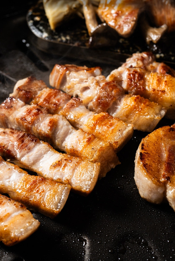 Doookbang charcoal-grilled aged pork with glowing coals