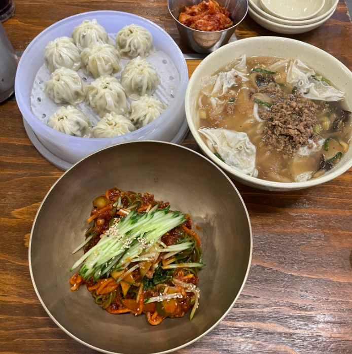 Myeongdong Kyoja bowls of kalguksu and dumplings