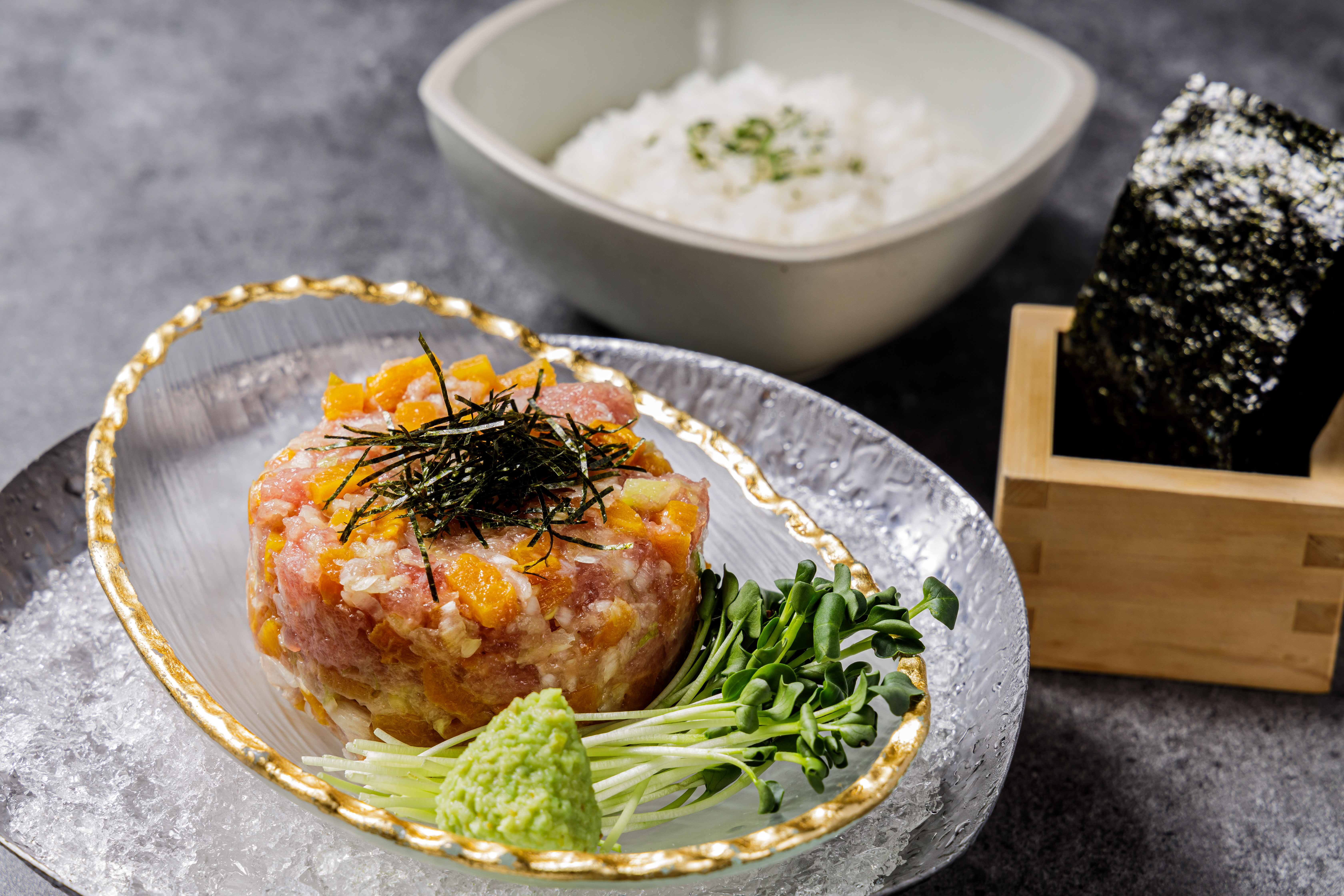 Kumo Bistro’s cozy izakaya setting with futomaki and bamboo-steamed dishes