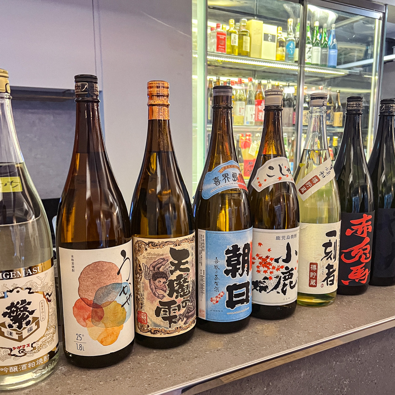 Shuhai sake bottles and seasonal izakaya plates