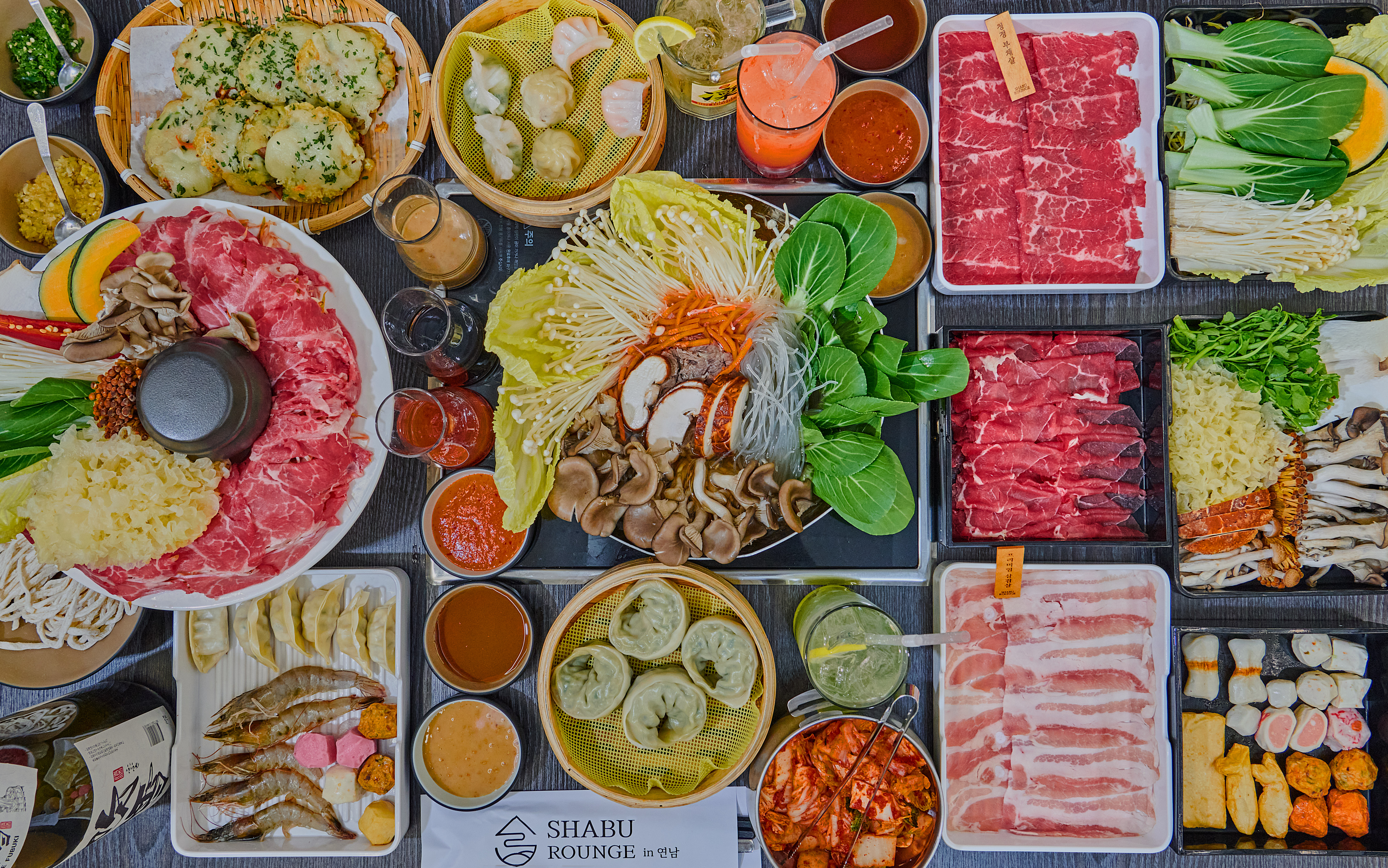 Individual shabu set in a leafy interior at Sshabu Rounge Yeonnam