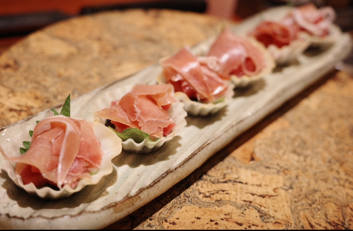 Eka Hyehwa cozy izakaya counter with sake and small plates