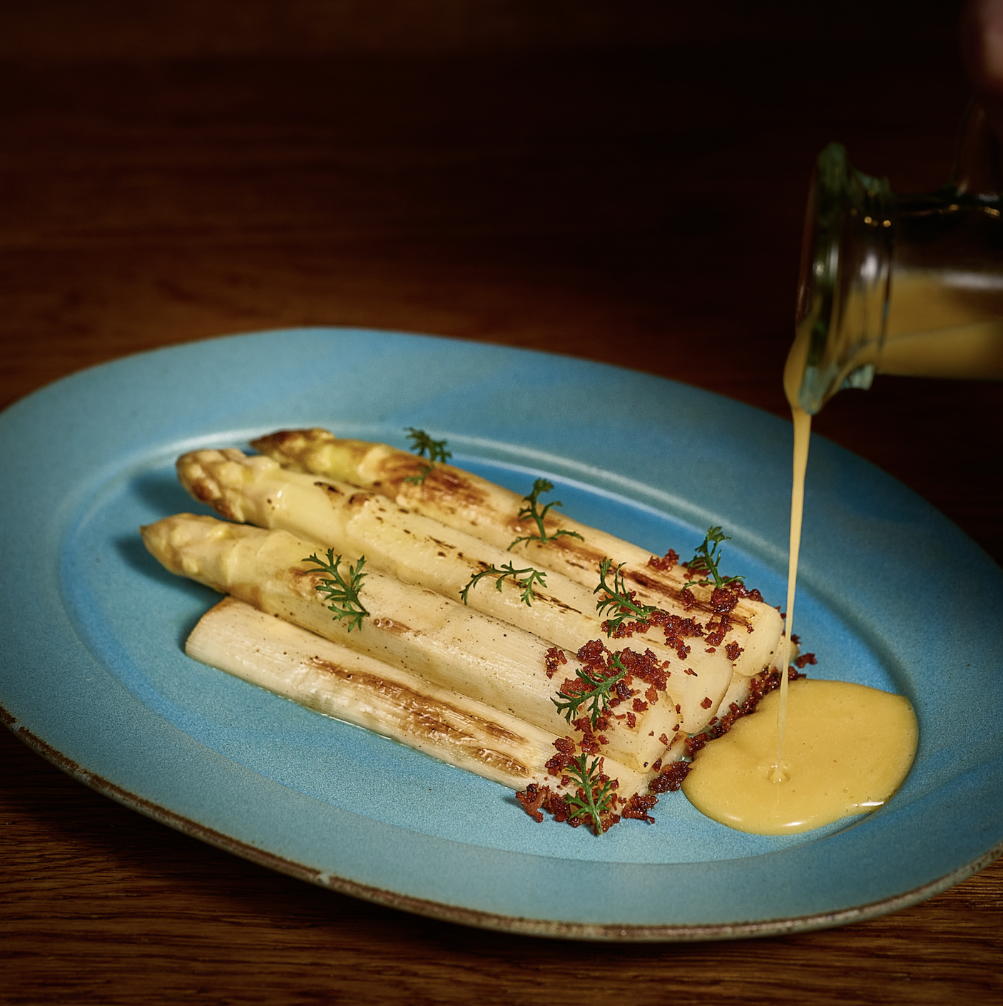 Ember Amber woodfire grill and wine shelves