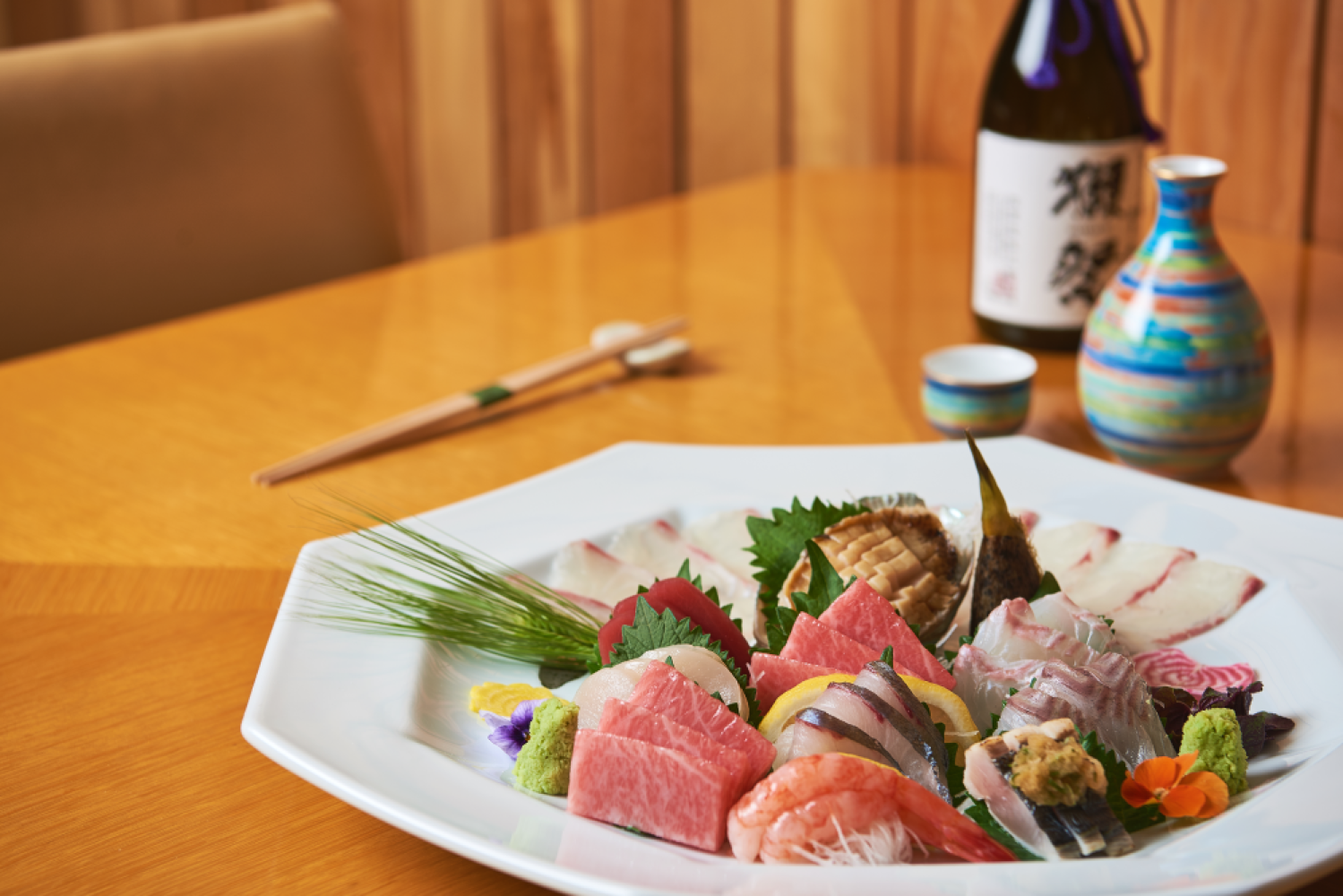 Momoyama sushi bar omakase with cityscape behind