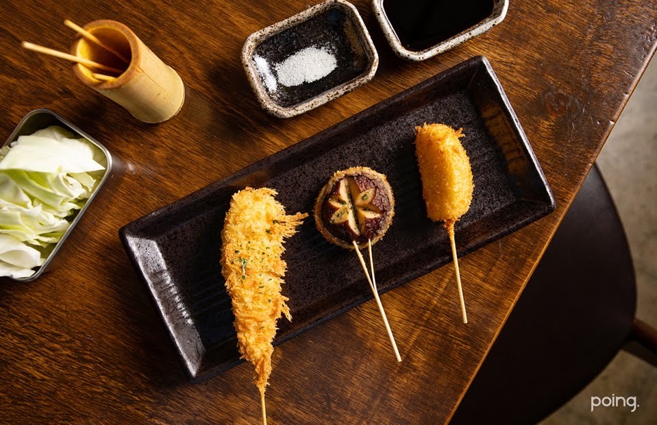 Kushikatsu Kushien golden fried skewers served sequentially