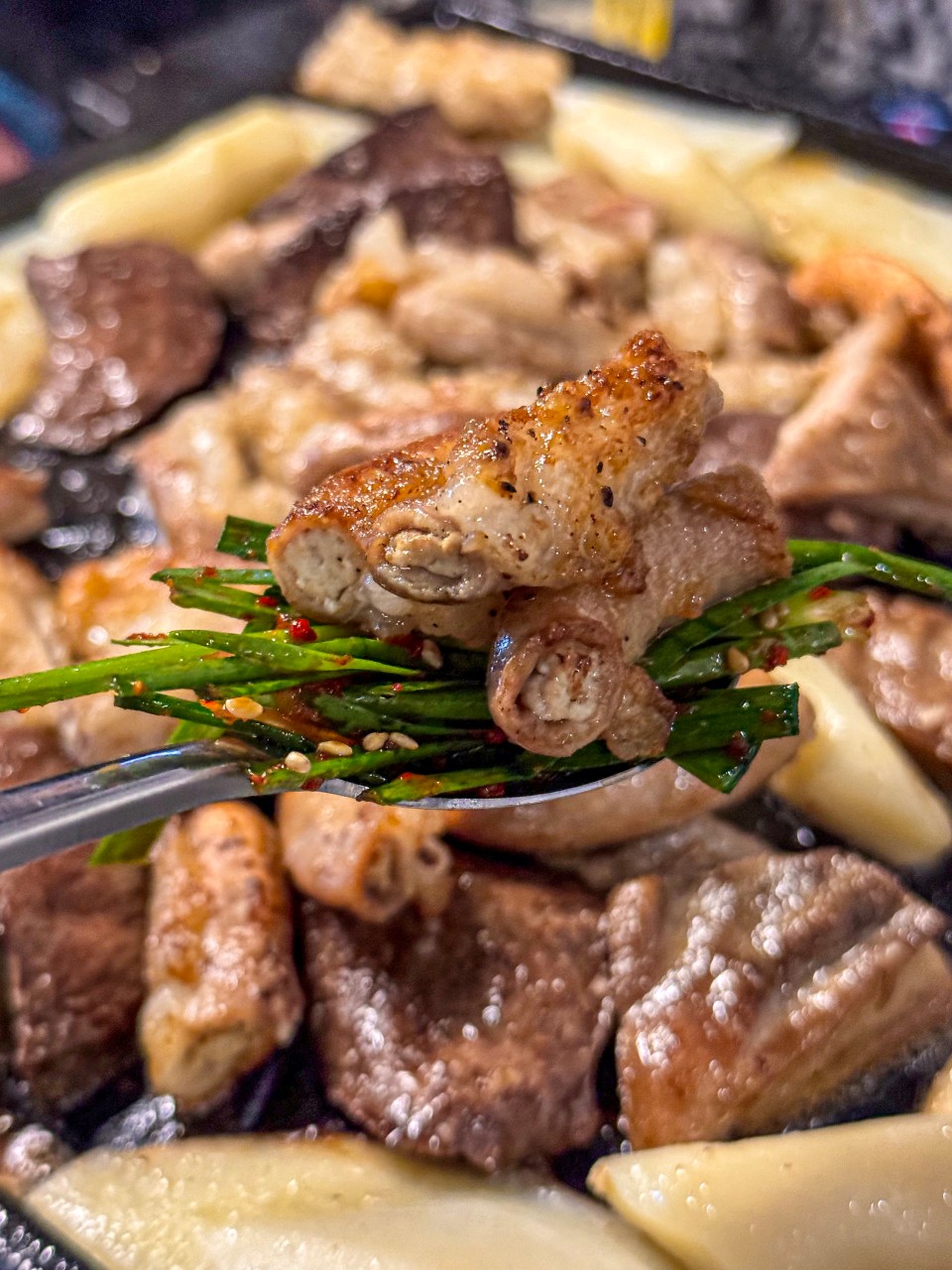 Sizzling gopchang on a grill at Gwak Gobchang