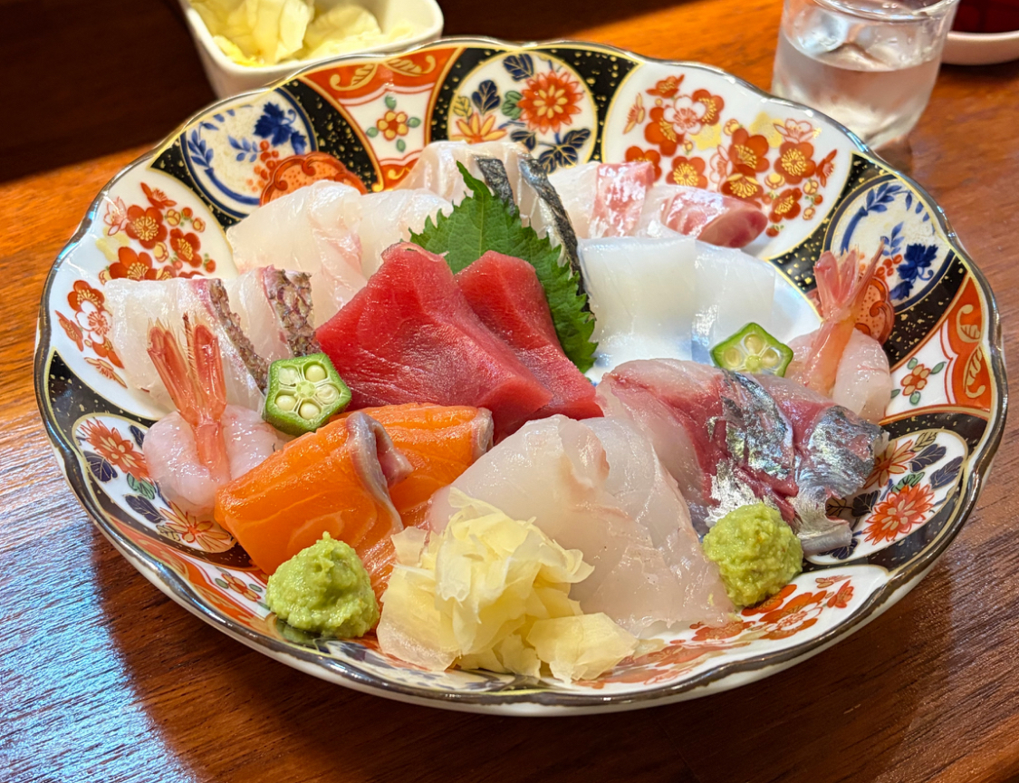 Shuboyodan izakaya counter with sake and sashimi