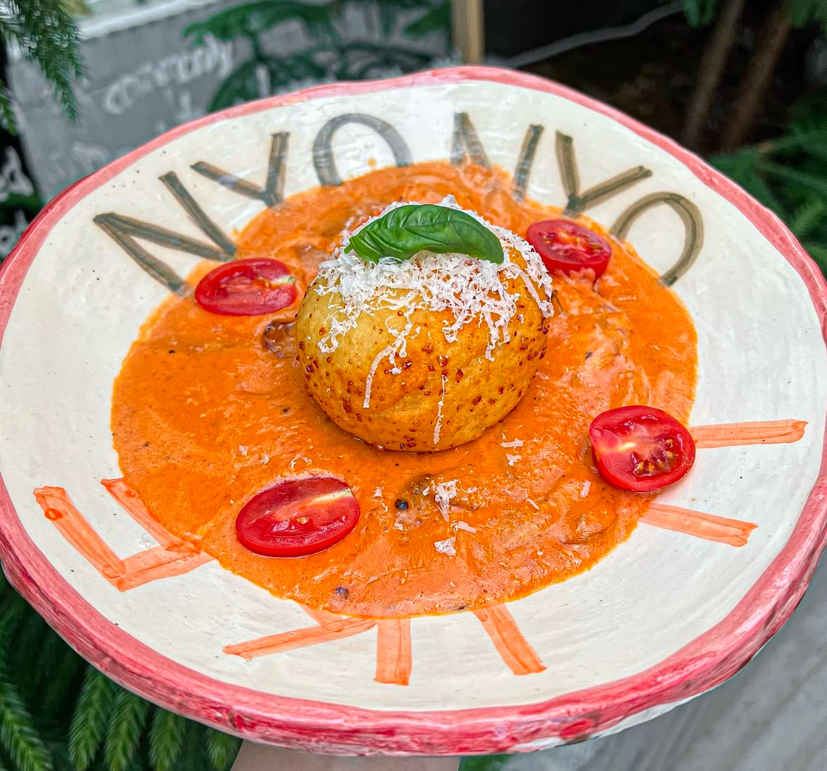 Nyonyo gnocchi and pasta with wine in a cute interior