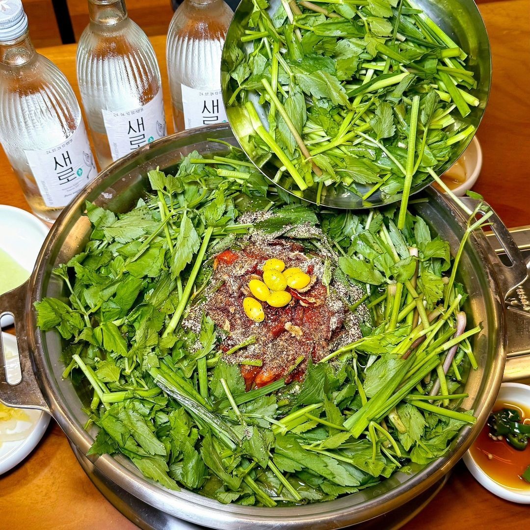 Cheongdo Minari Restaurant table with duck jeongol and greens