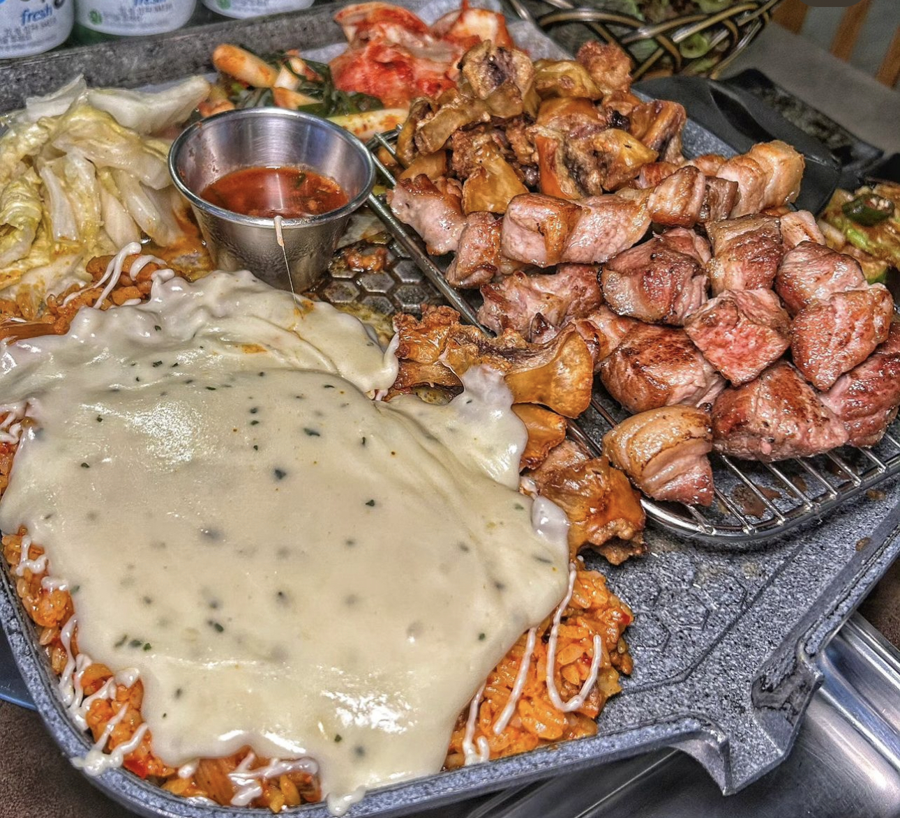 Dongooun river-view dining room with plated aged pork