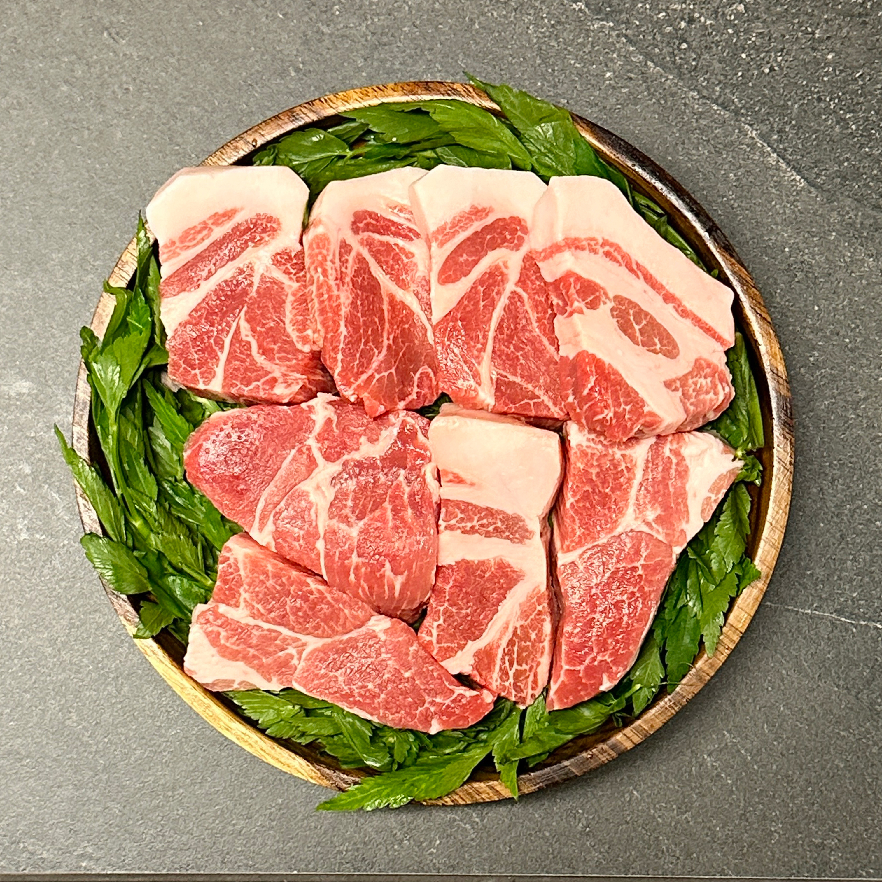 Moonbaek Charcoal Master grilling black pork over glowing coffee charcoal in Jamsil